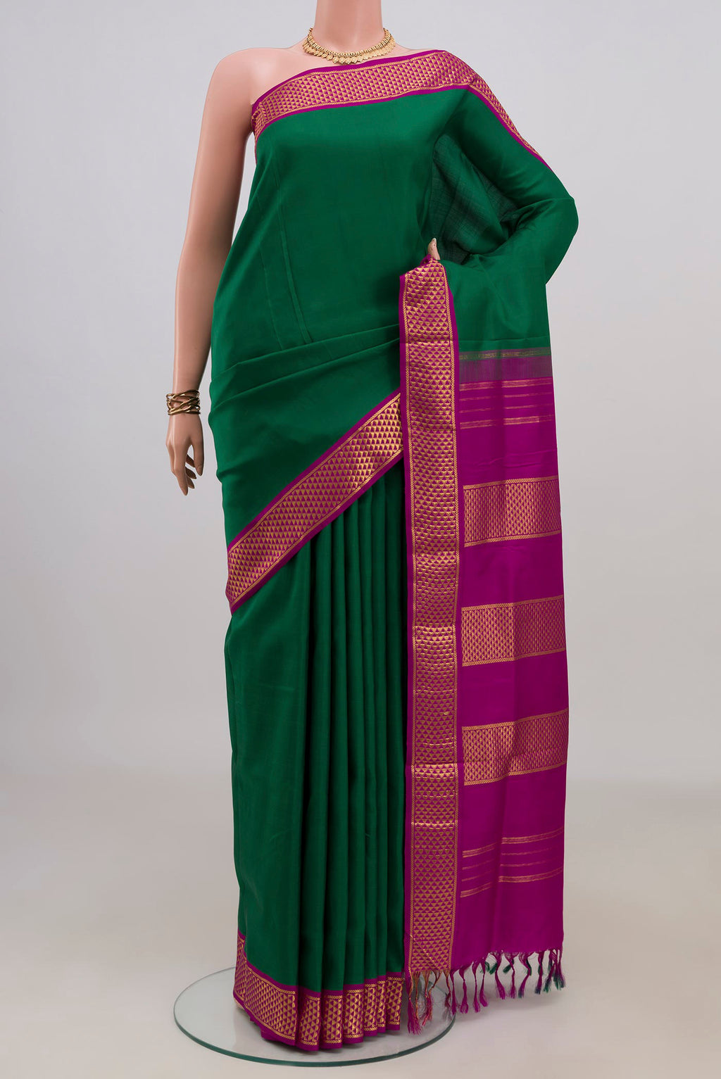 Pure Silk Green Kanchipuram Nine Yards Saree with Plain Body and Zari Border.  displayed on a mannequin