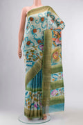 Blue Tussar Silk Saree with Printed design on the body and Zari Border displayed on a mannequin