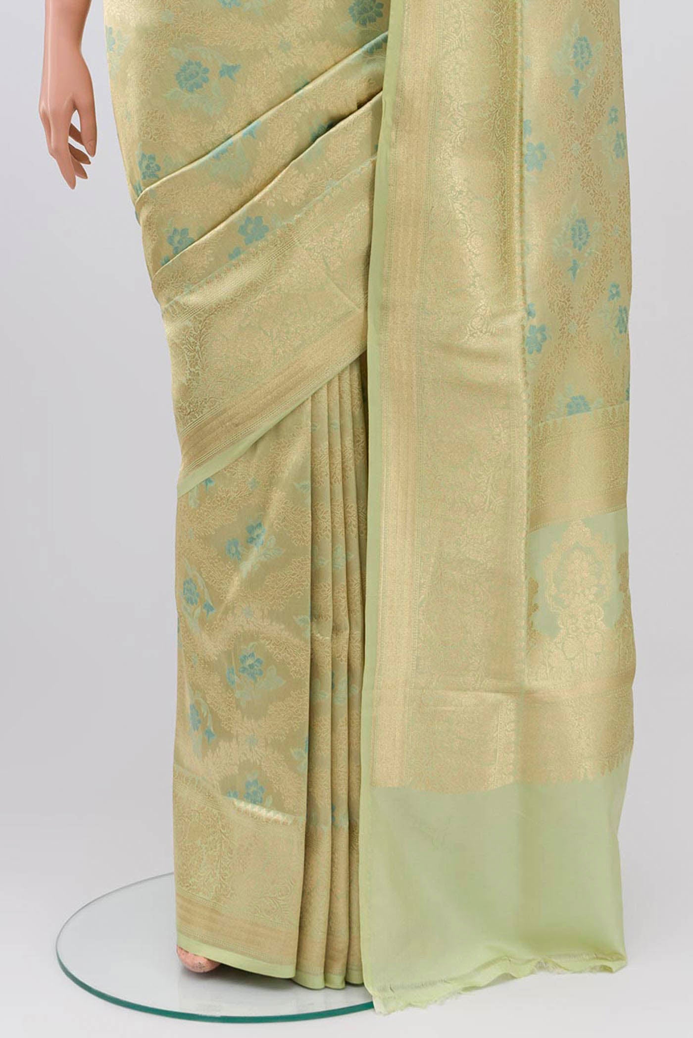 Pleats and pallu of Beige Banarasi Silk Saree with Zari And Thread Butta on the body and Zari Border