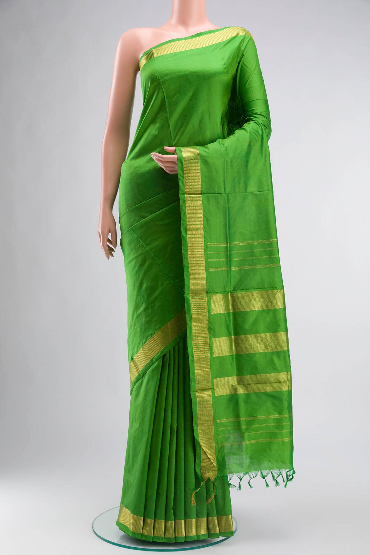 Green Kanchipuram Silk Nine Yards Saree with Plain Body and Zari Border displayed on a mannequin