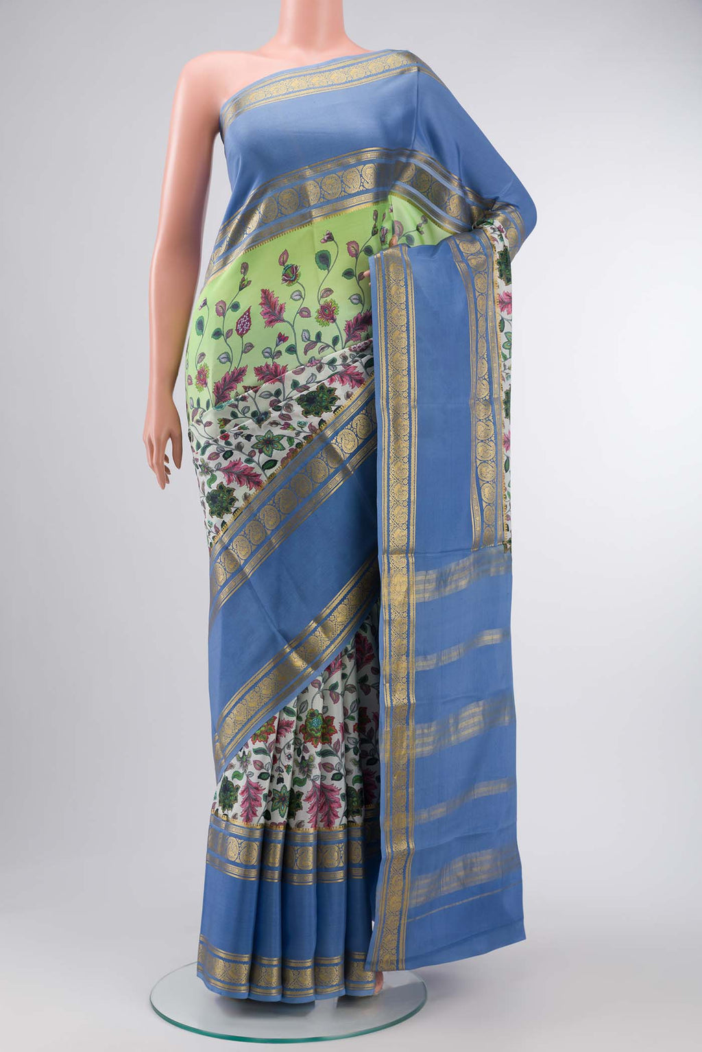 Green Mysore Crepe Saree with Floral Print on the body and Zari Border displayed on a mannequin
