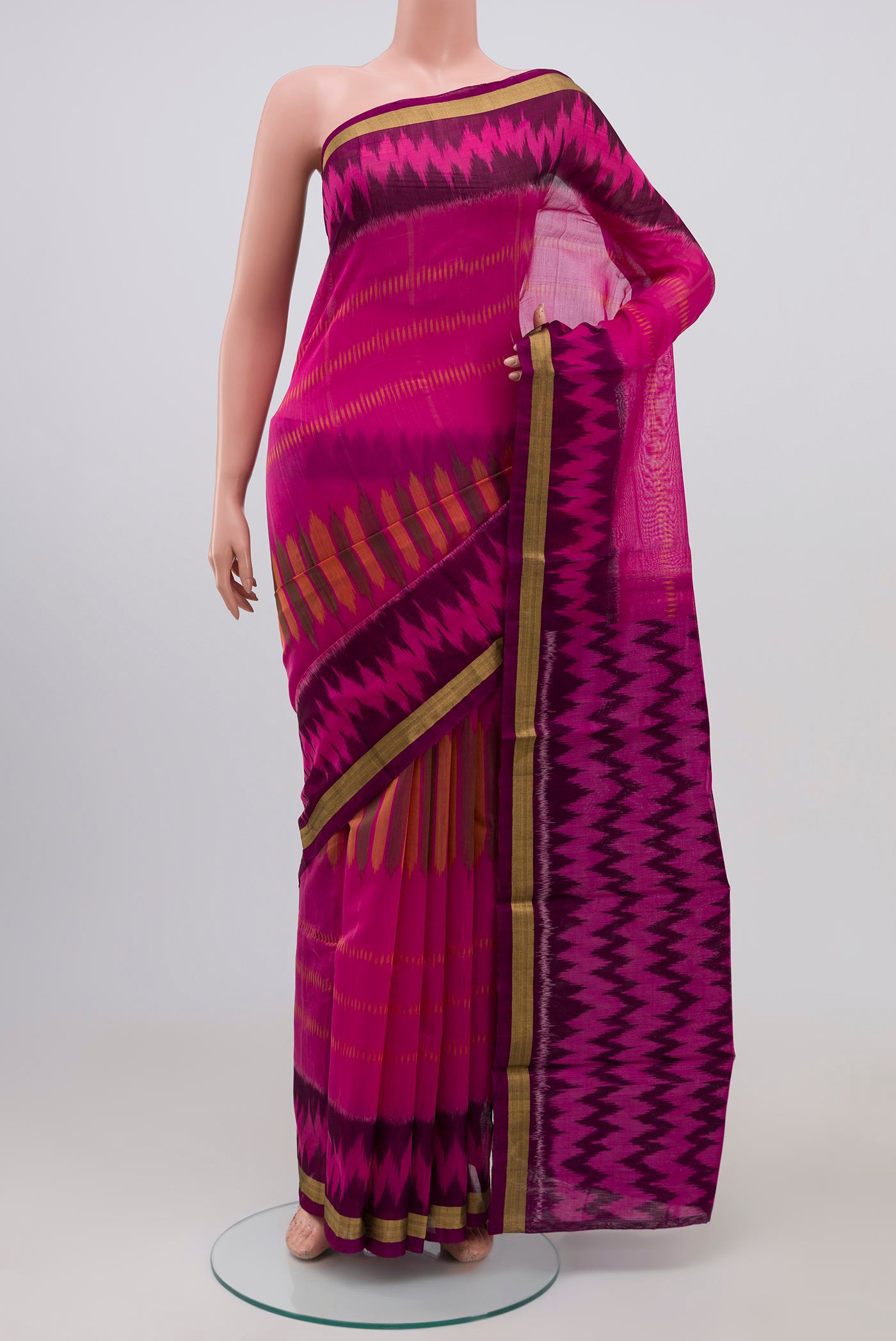Pink Coimbatore Silk Cotton Saree with Ikat Print on the body and Zari Border.  displayed on a mannequin