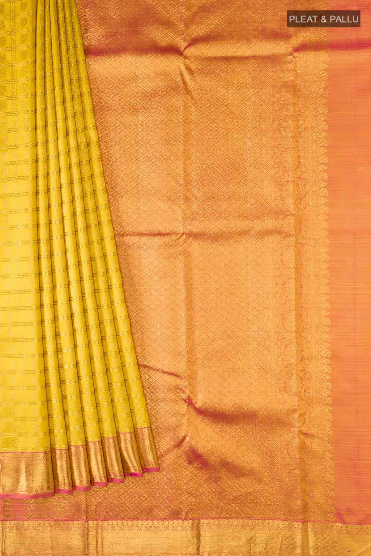 Pleats and pallu of Yellow Kanchipuram Silk Saree with Zari Brocade on the body and Zari Border