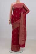 Maroon Mysore Crepe Saree with Zari Butta on the body and Zari Border.  displayed on a mannequin