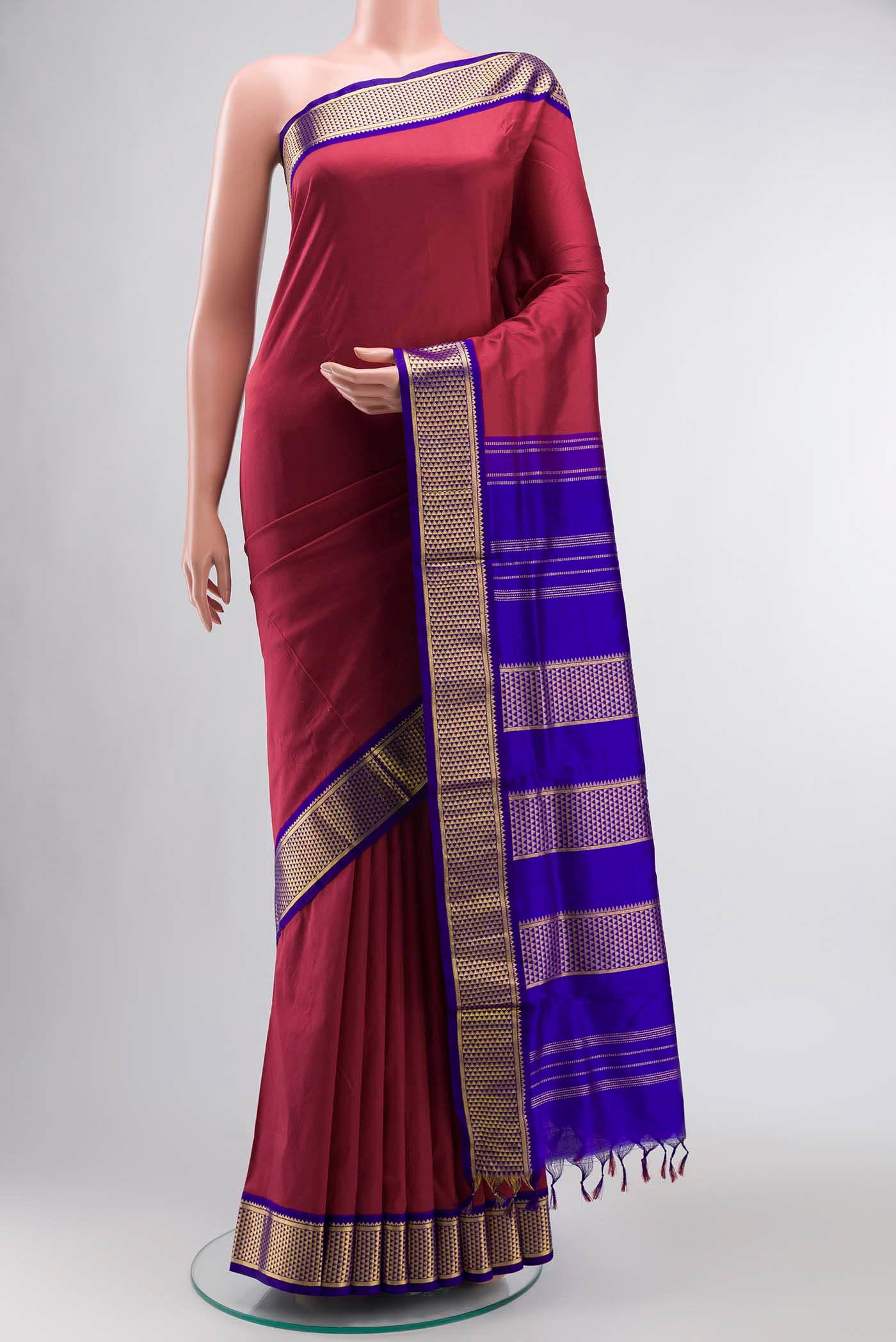 Maroon Kanchipuram Silk Nine Yards Saree with Plain Body and Zari Border displayed on a mannequin