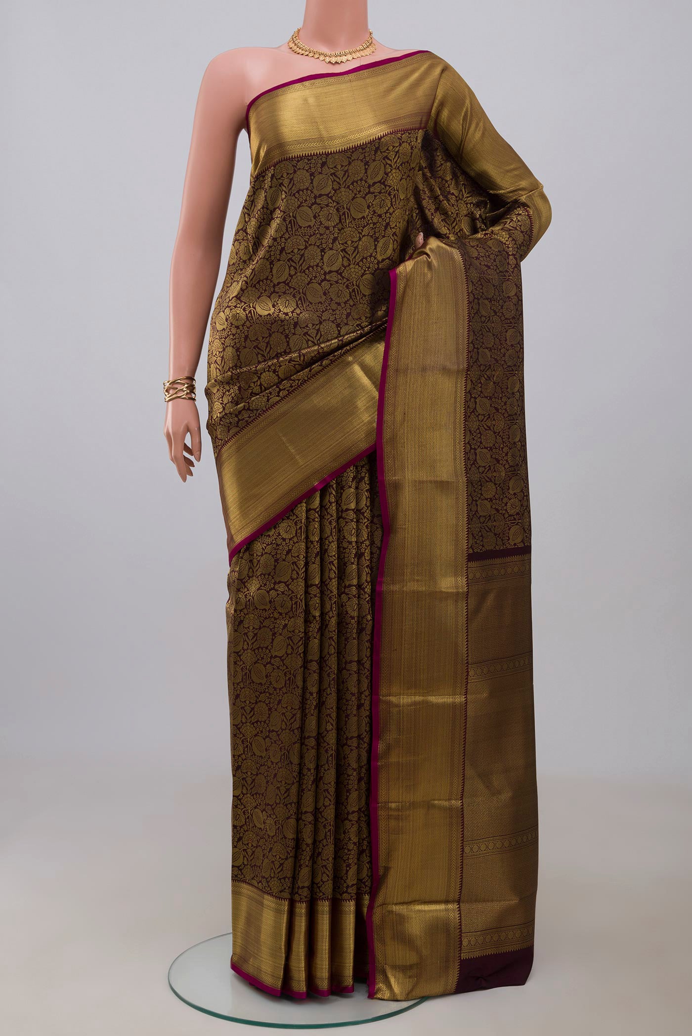 Pure Silk Pure Zari Coffee Brown Kanjivaram Saree with Zari Brocade on the body and Zari Border.  displayed on a mannequin
