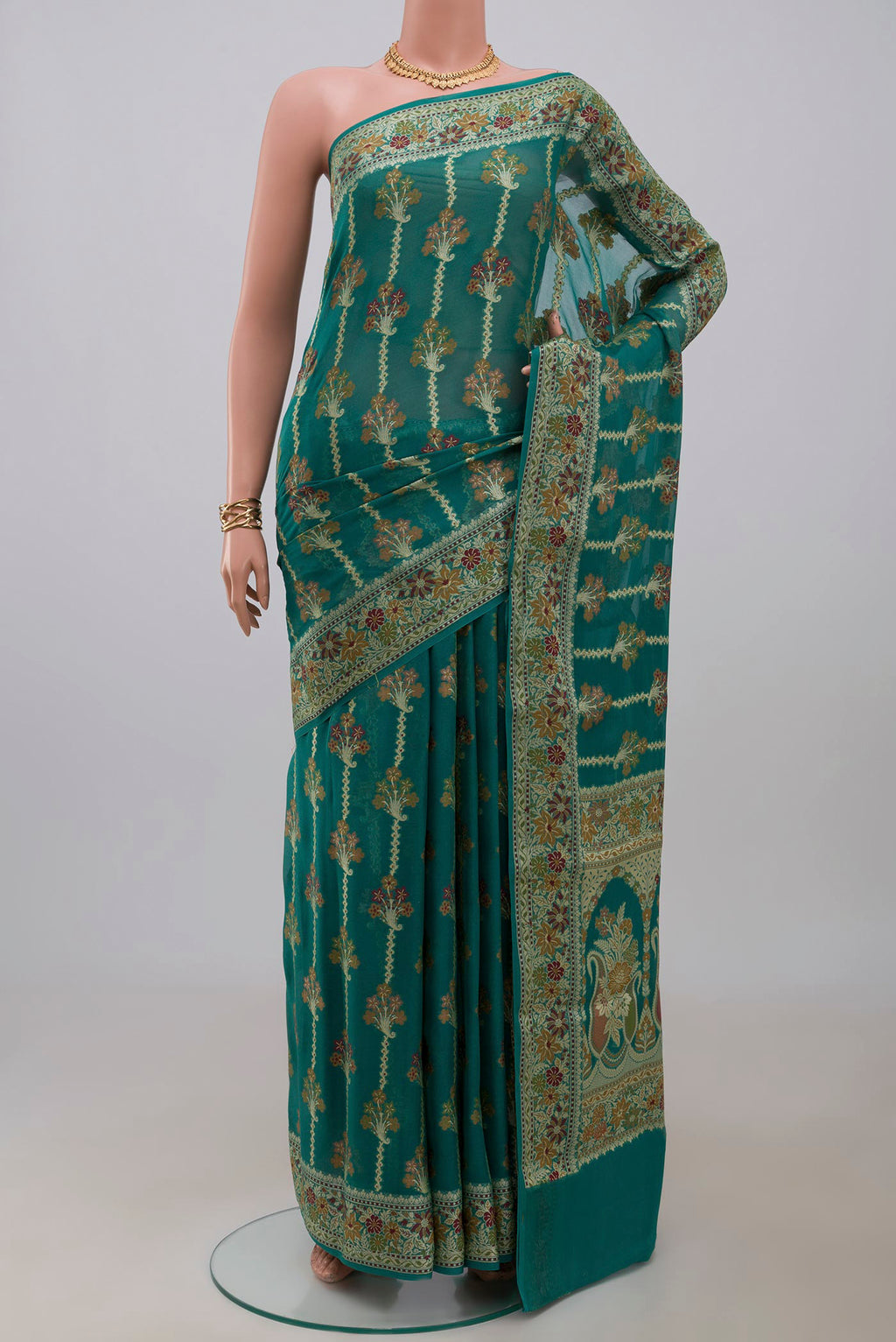 Sea Green Banarasi Georgette Saree with Thread Butta on the body and Thread Border.  displayed on a mannequin