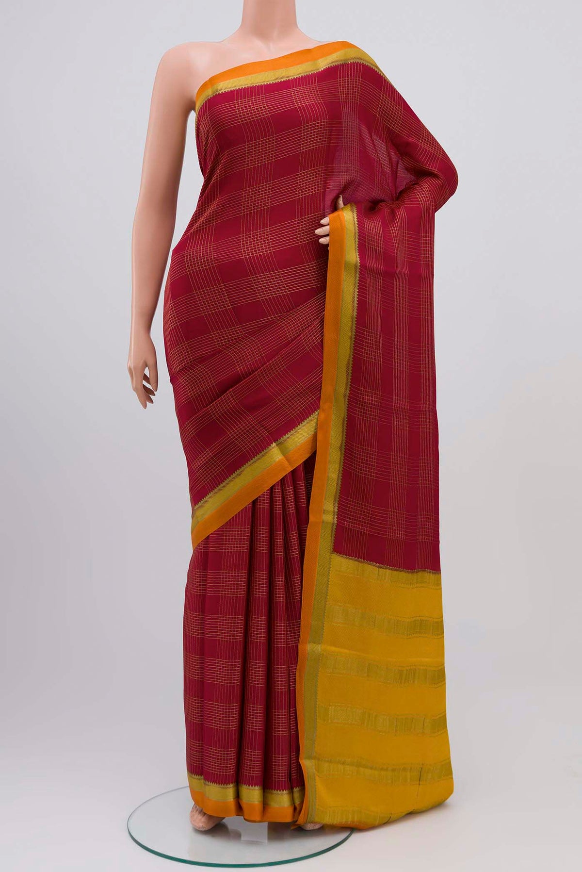 Maroon Mysore Crepe Saree with Checked design on the body and Zari Border displayed on a mannequin