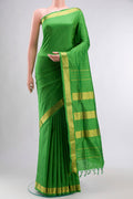 Green Kanchipuram Silk Nine Yards Saree with Plain Body and Zari Border displayed on a mannequin