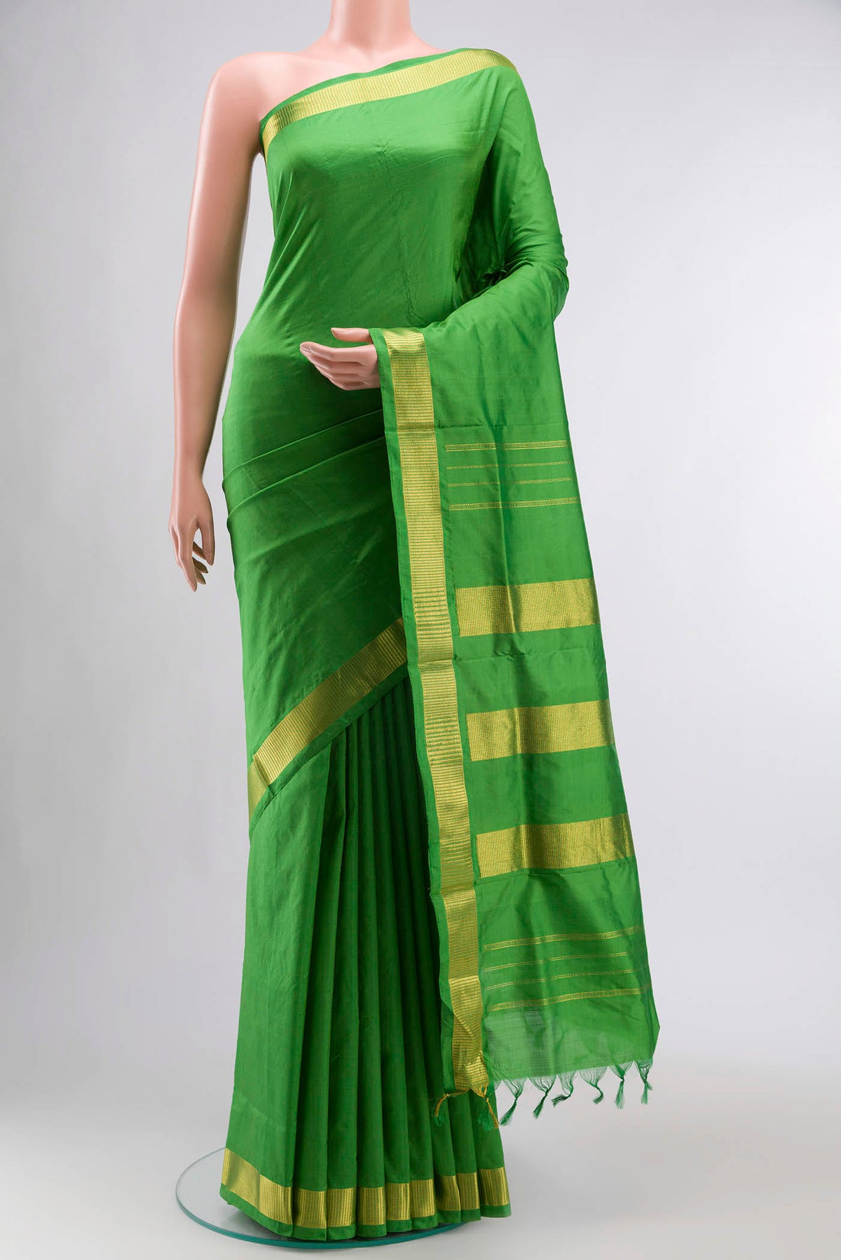 Green Kanchipuram Silk Nine Yards Saree with Plain Body and Zari Border displayed on a mannequin