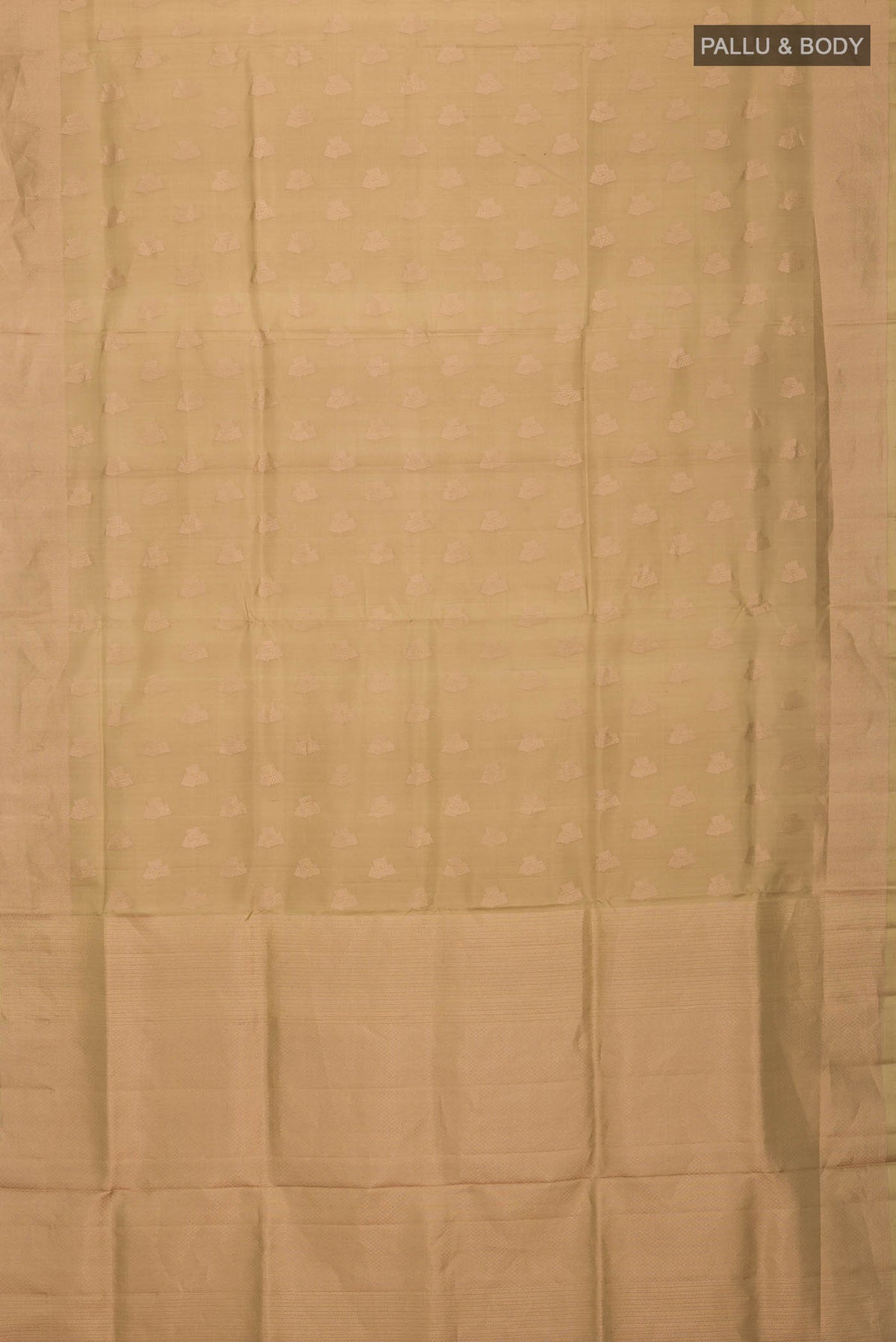 Flat view of Beige Soft Silk Saree with Zari Butta on the body and Zari Border