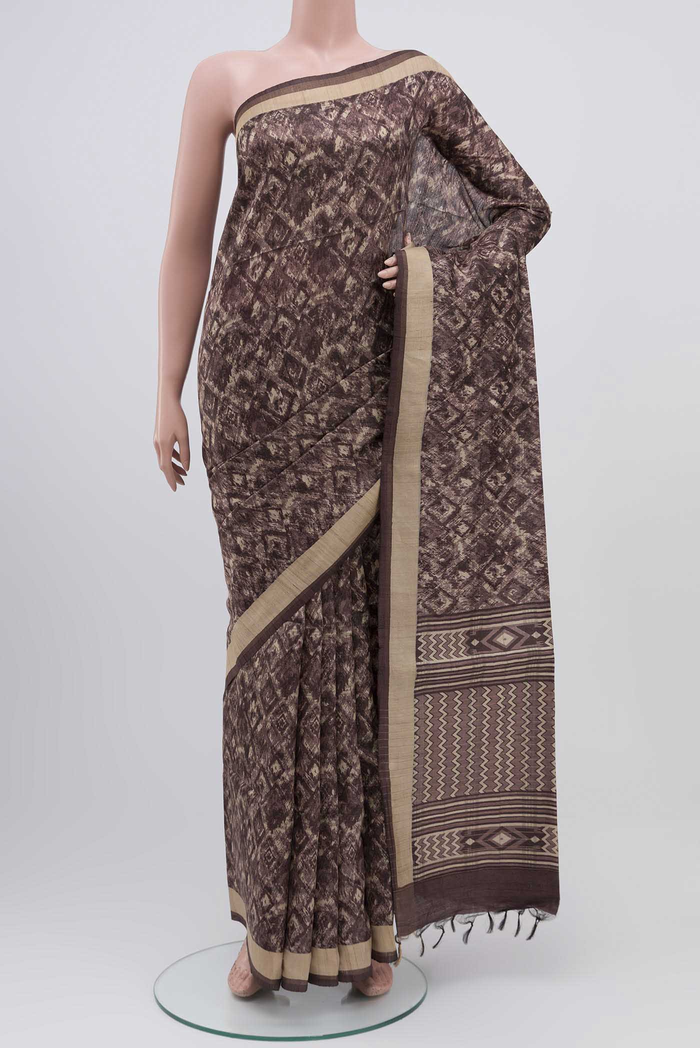 Brown Bhagalpuri Tussar Silk Saree with Printed design on the body and Zari Border displayed on a mannequin