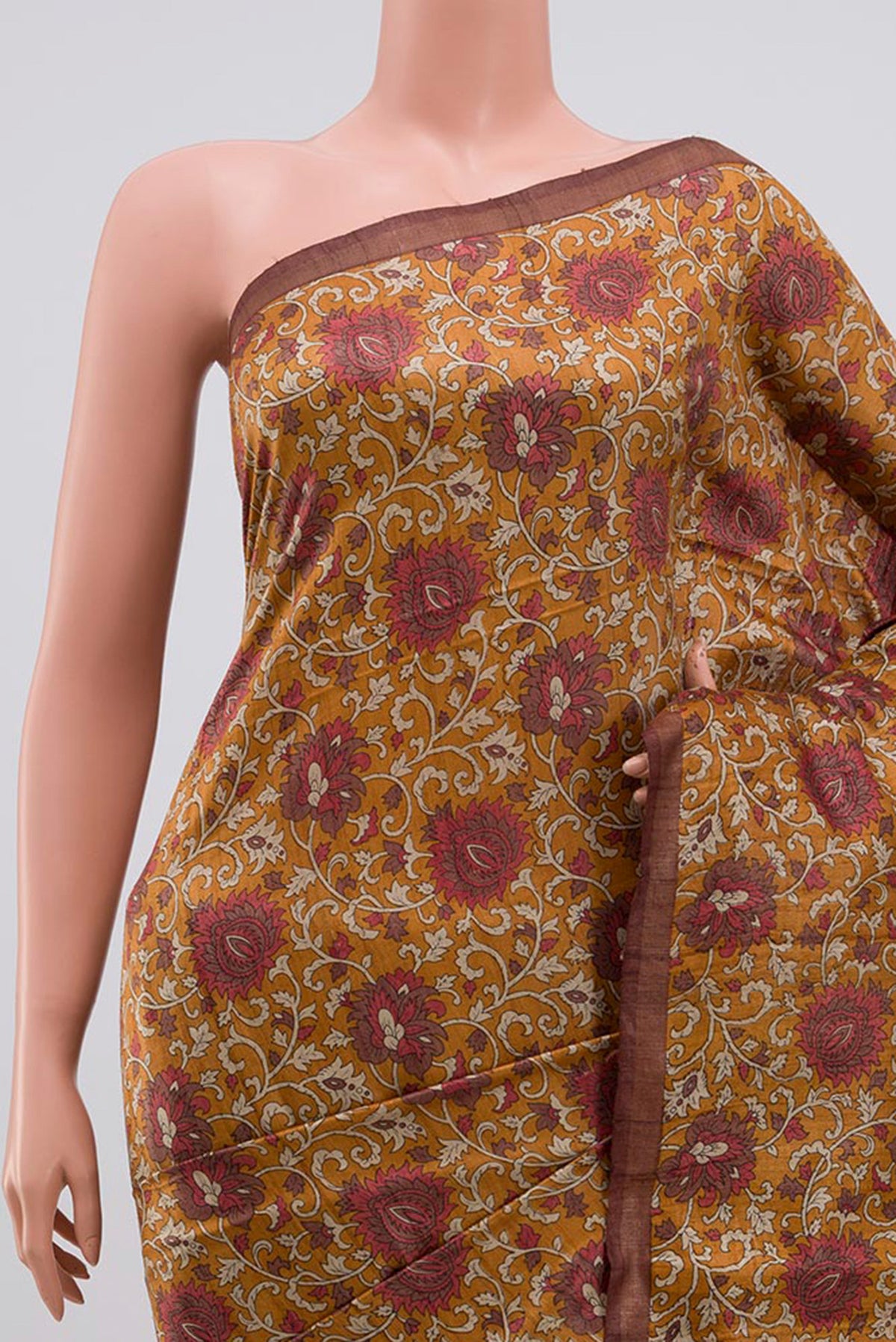 Border image of Brown Tussar Silk Saree with Printed design on the body and Thin Zari Line. 