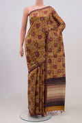 Brown Tussar Silk Saree with Printed design on the body and Thin Zari Line.  displayed on a mannequin