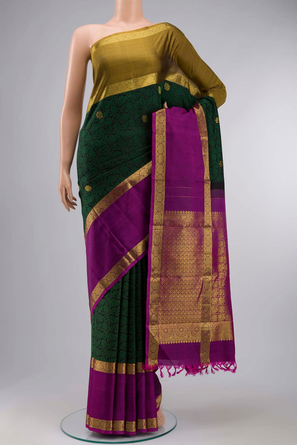 Black Kanchipuram Silk Saree with Jacquard design on the body and Ganga Jamuna Border displayed on a mannequin