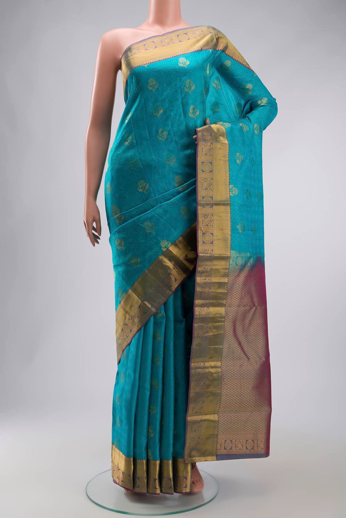 Blue Kanchipuram Silk Saree with Jacquard With Zari Butta on the body and Zari Border displayed on a mannequin