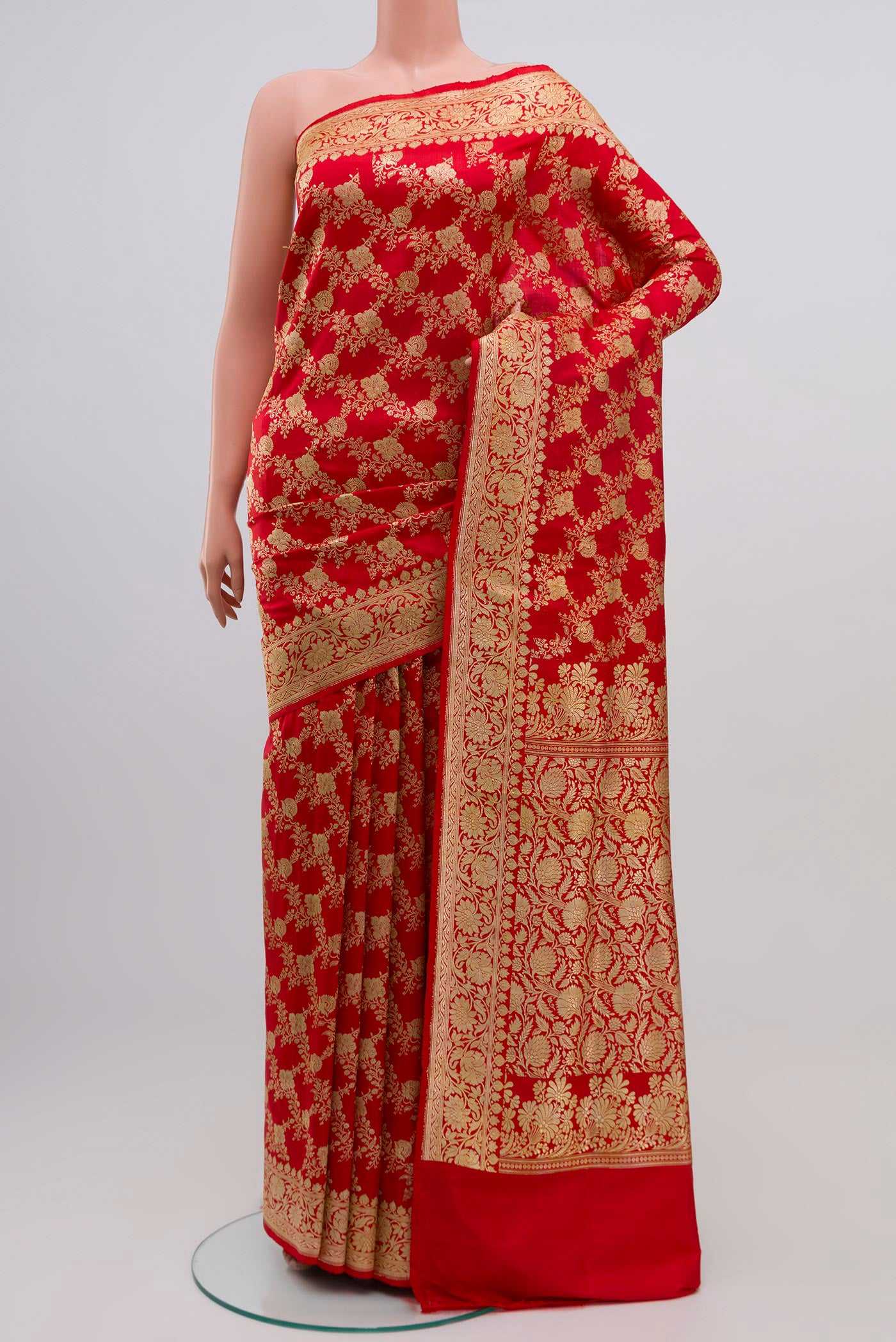 Red Banarasi Saree with Zari Brocade on the body and Zari Border.  displayed on a mannequin