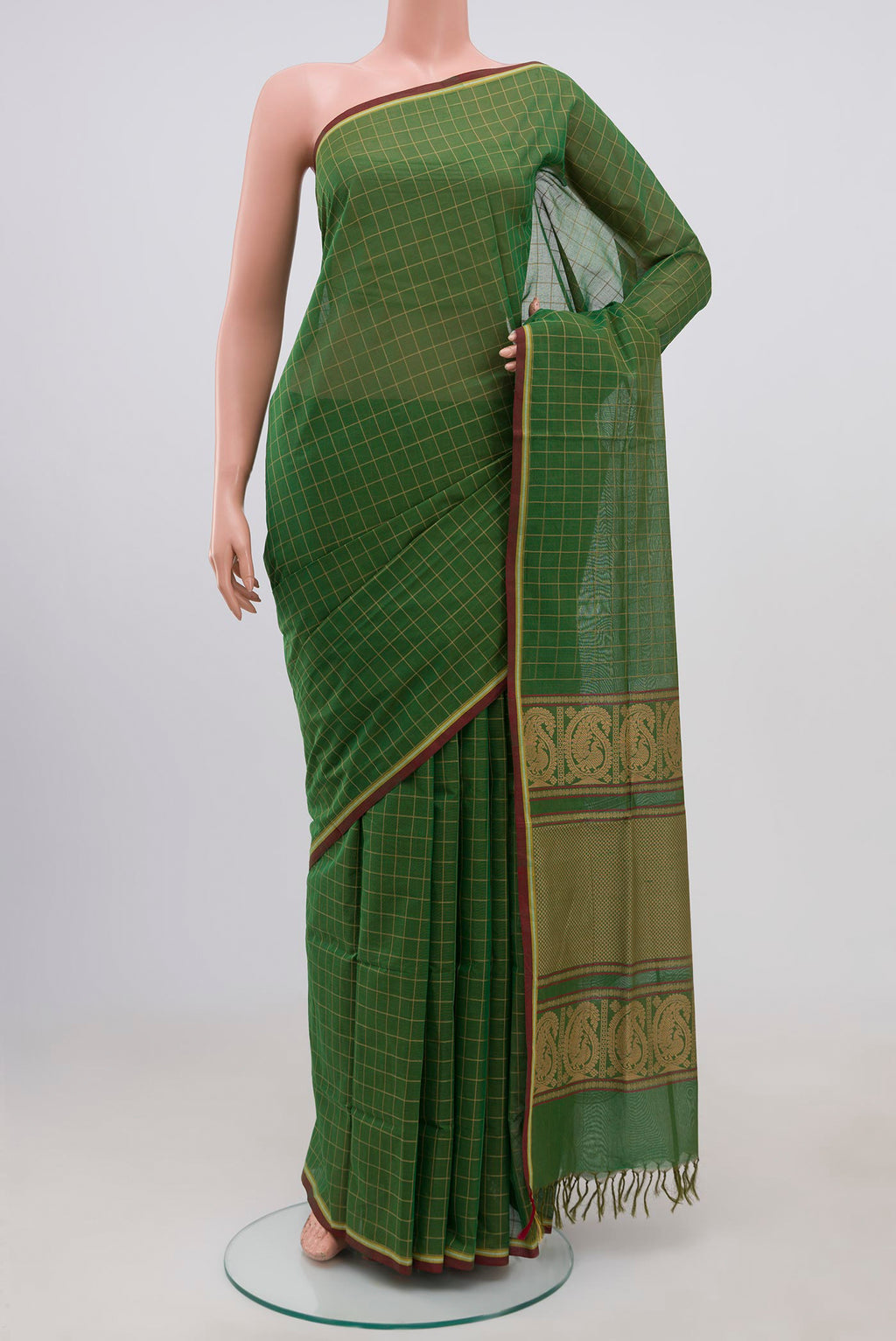 Green Coimbatore Cotton Saree with Checked design on the body and Without Border.  displayed on a mannequin