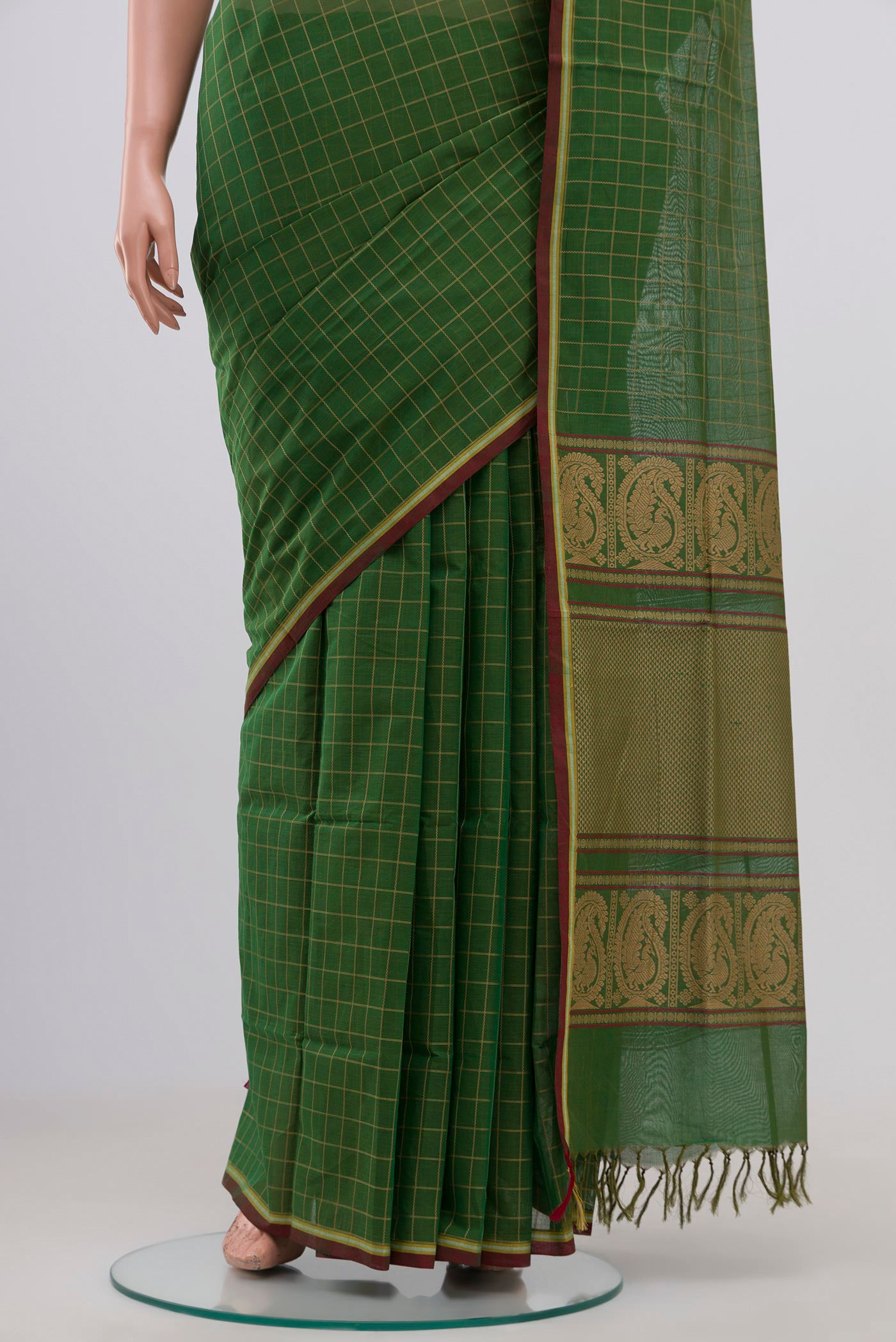 Pleats and pallu of Green Coimbatore Cotton Saree with Checked design on the body and Without Border. 