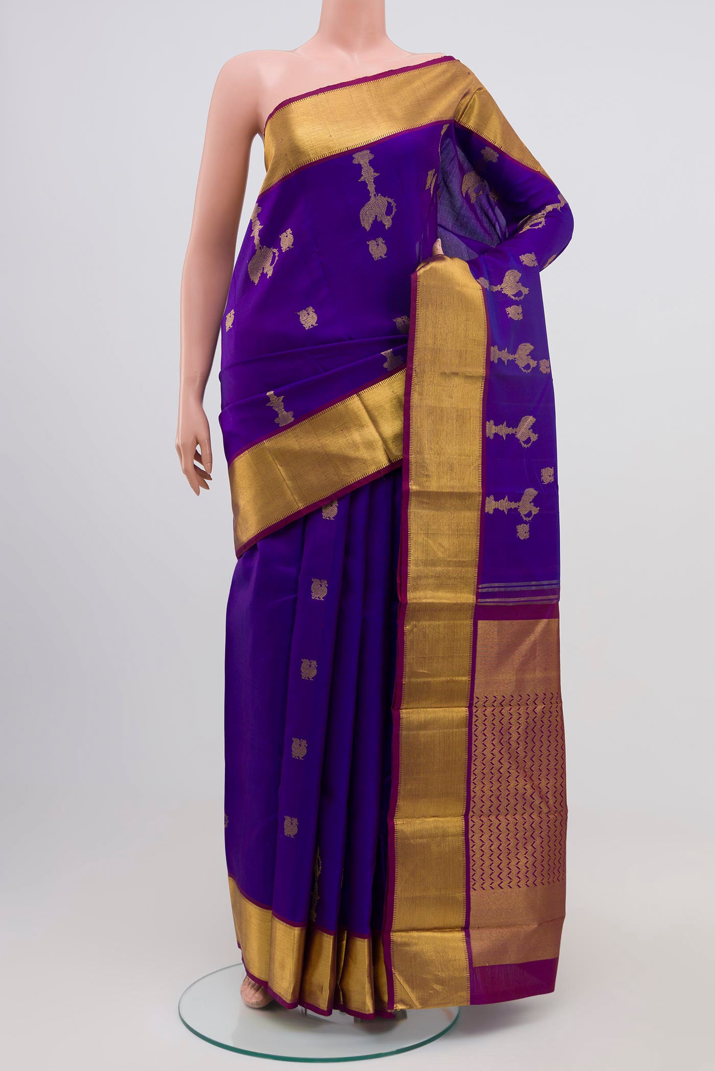 Blue Dual Tone Kanjivaram Silk Saree with Zari Butta on the body and Zari Border.  displayed on a mannequin