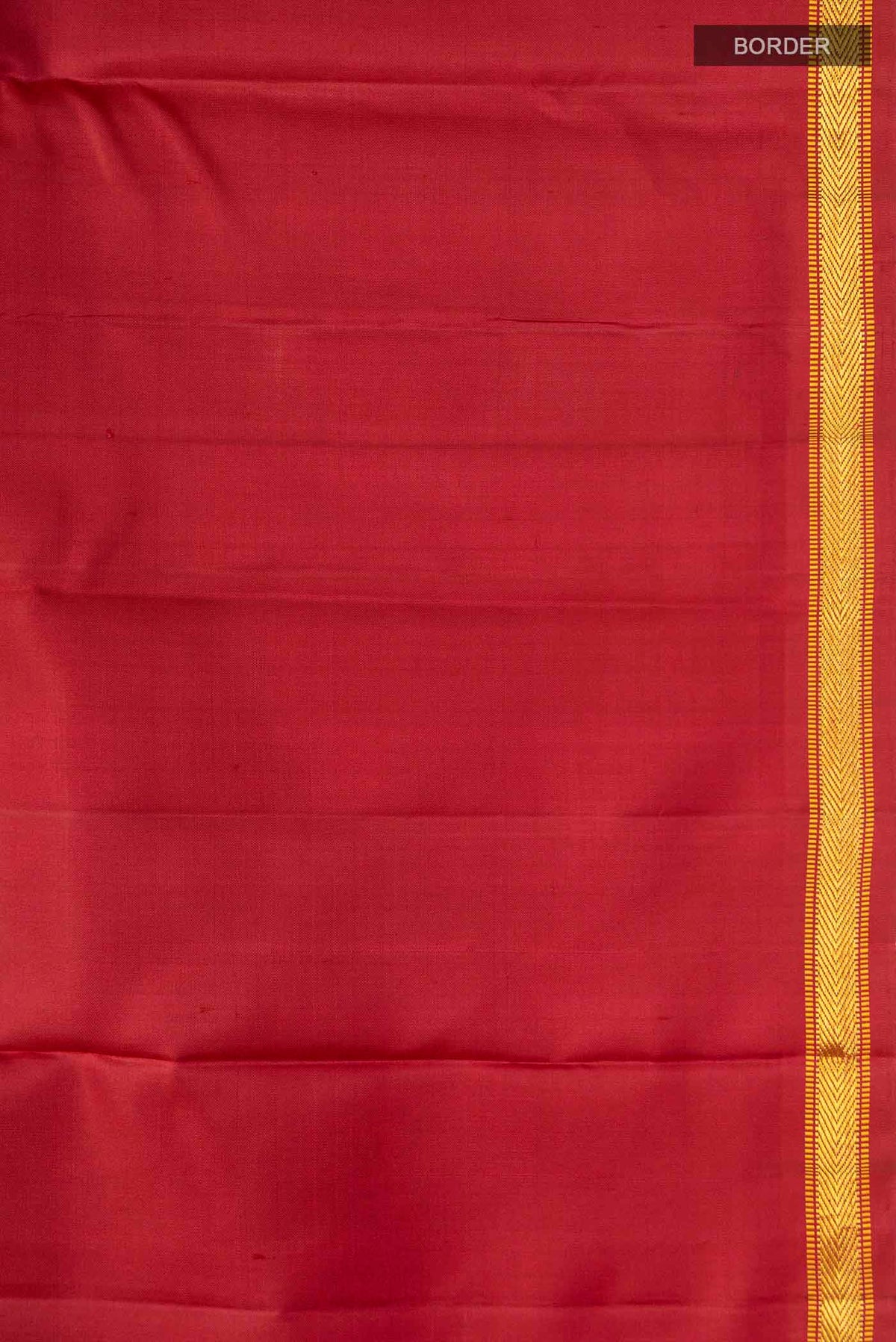 Border image of Maroon Kanchipuram Silk Saree with Zari Butta on the body and Zari Border