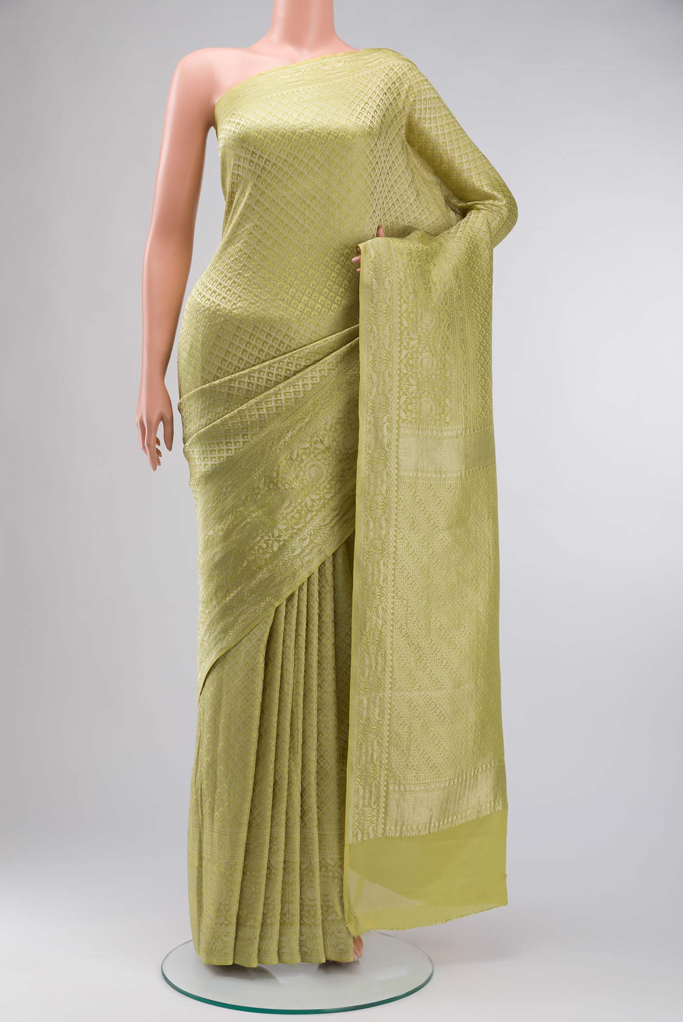 Yellow Mysore Crepe Saree with Zari Brocade on the body and Zari Border displayed on a mannequin