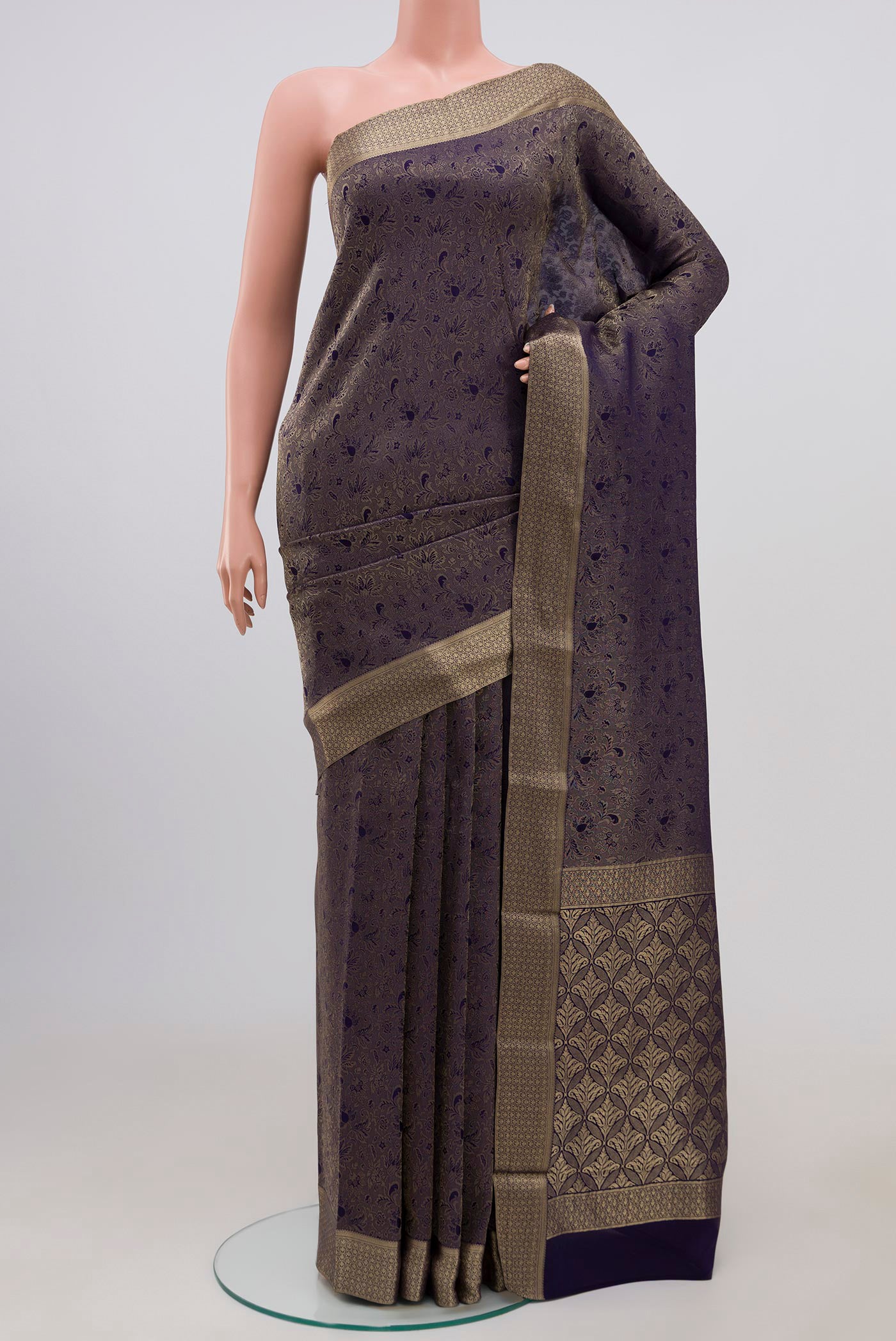 Navy Blue Mysore Crepe Saree with Zari Brocade on the body and Zari Border.  displayed on a mannequin
