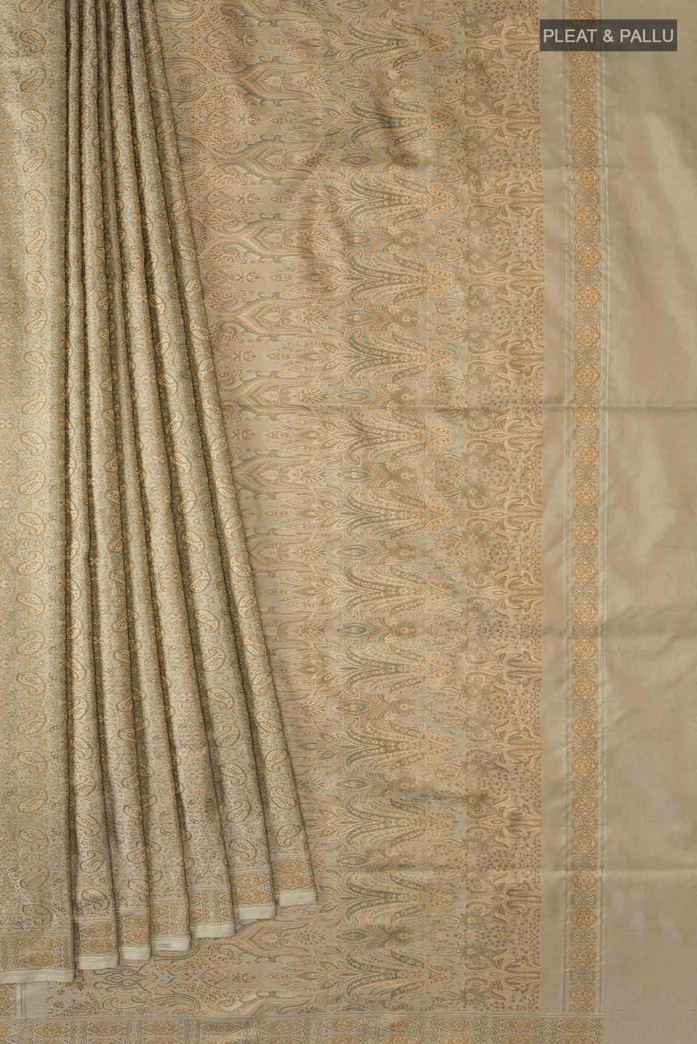 Pleats and pallu of Beige Banarasi Tanchoi Silk Saree with Jacquard design on the body and Thread Border