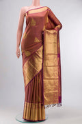 Maroon Kanchipuram Silk Saree with Jacquard With Zari Butta on the body and Zari Border displayed on a mannequin
