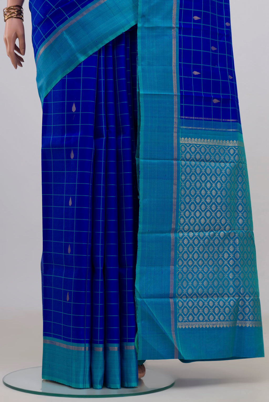 Pleats and pallu of Pure Silk Royal Blue Kanjivaram Saree with Checked design on the body and Plain Border. 