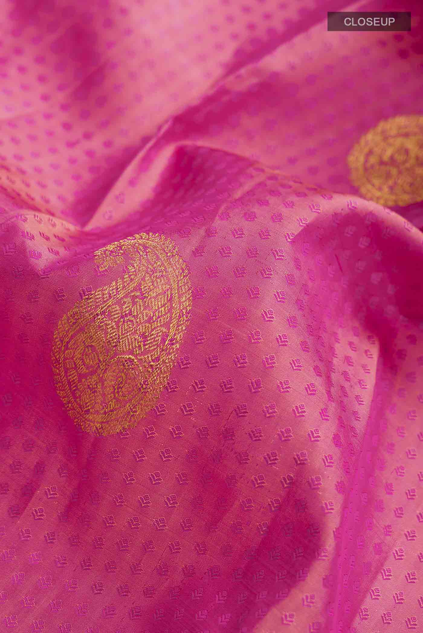 Close up of Multicolor Kanchipuram Silk Saree with Jacquard With Zari Butta on the body and Zari Border displaying folds