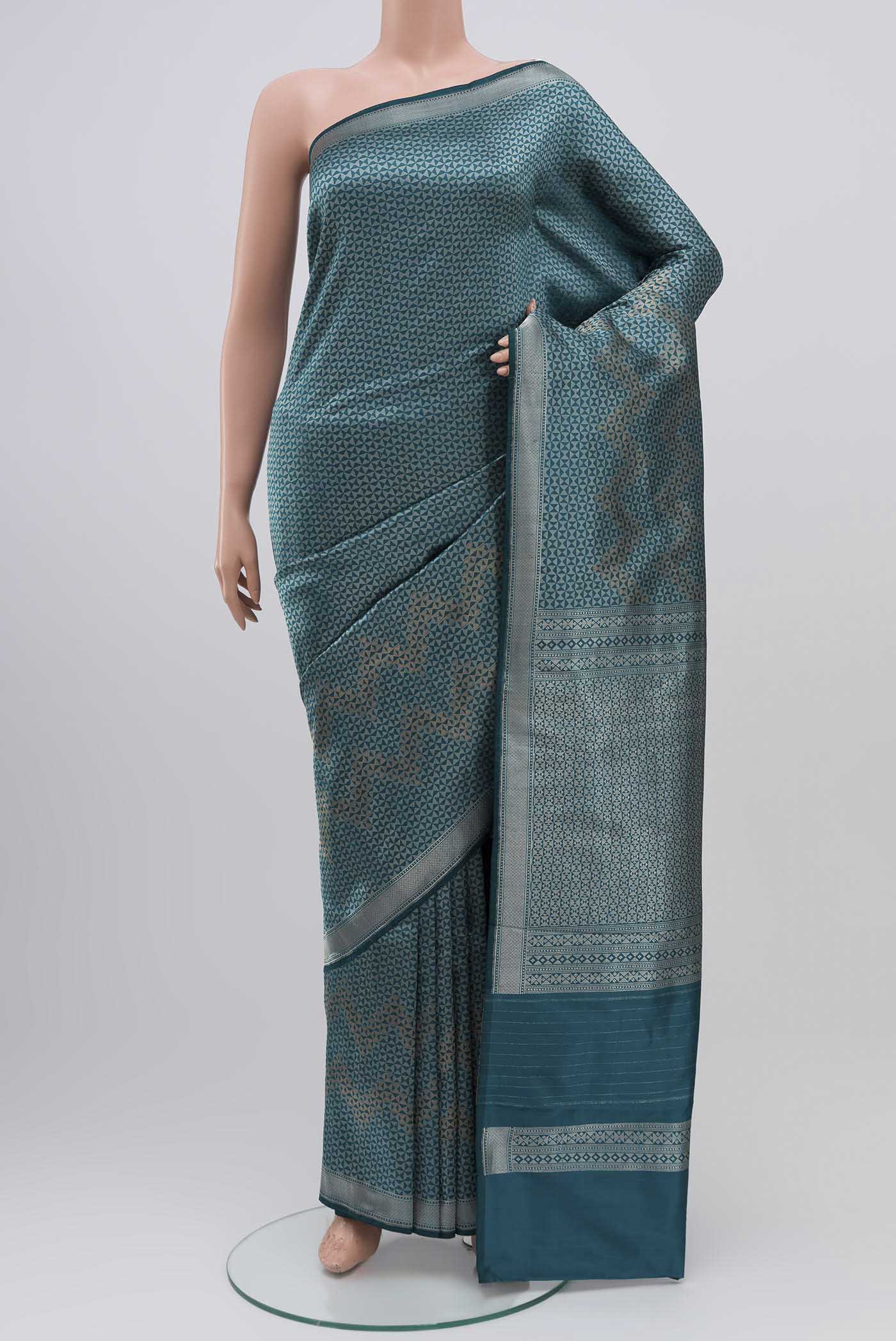 Turquoise Banarasi Katan Silk Saree with Zari Brocade on the body and Zari Border displayed on a mannequin