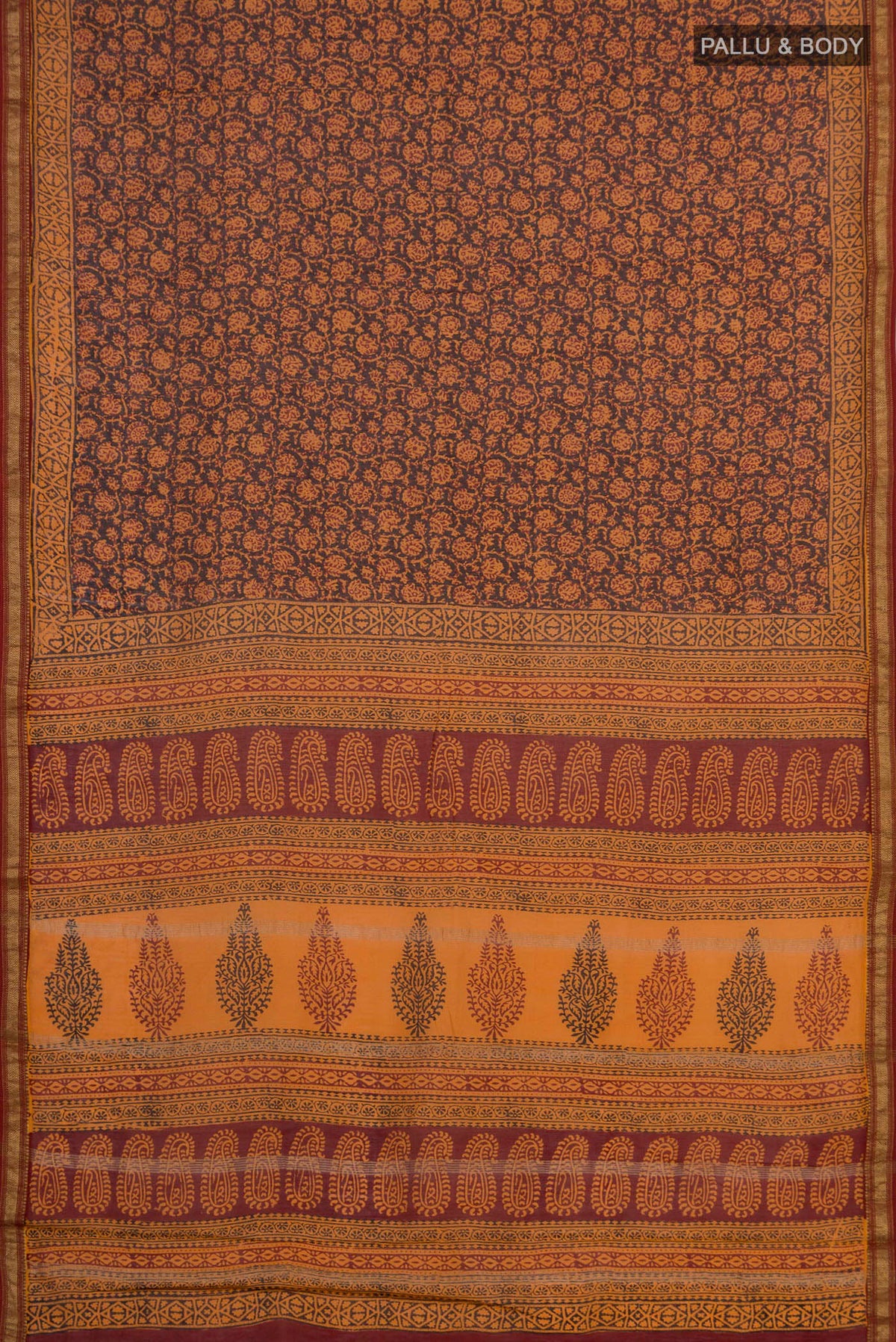 Flat view of Brick Orange Maheshwari Silk Cotton Saree with Printed design on the body and Zari Border. 