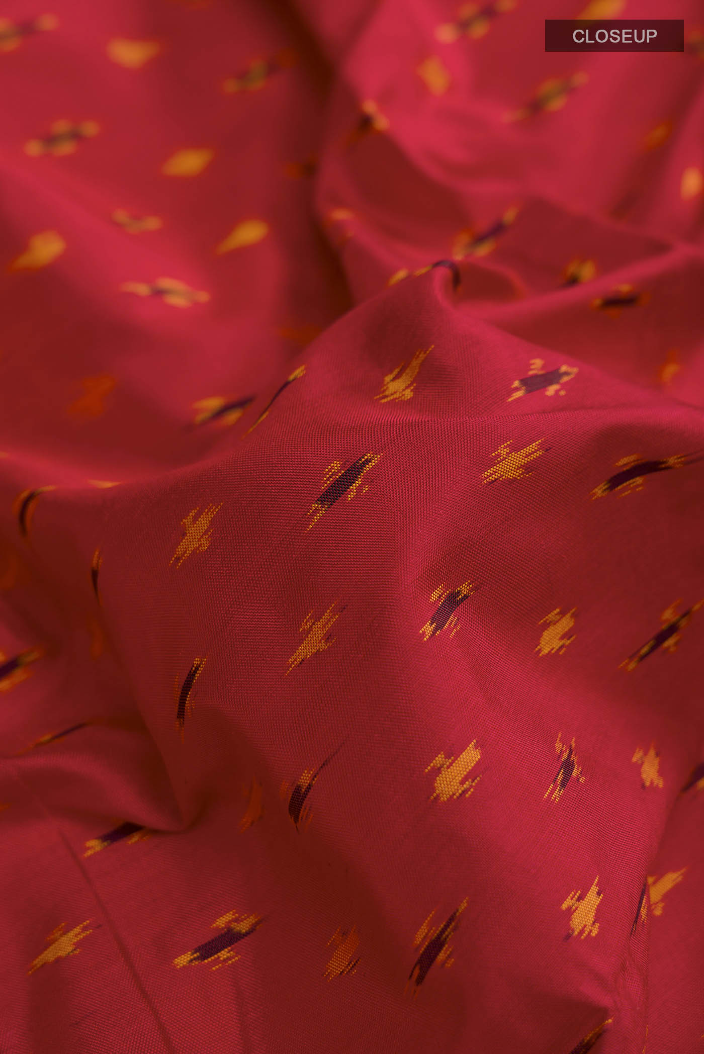 Close up of Red Pochampally Silk Saree with Pure Ikat on the body and Zari Border displaying folds