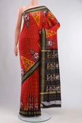 Red Pochampally Silk Saree with Pure Ikat on the body and Zari Border displayed on a mannequin