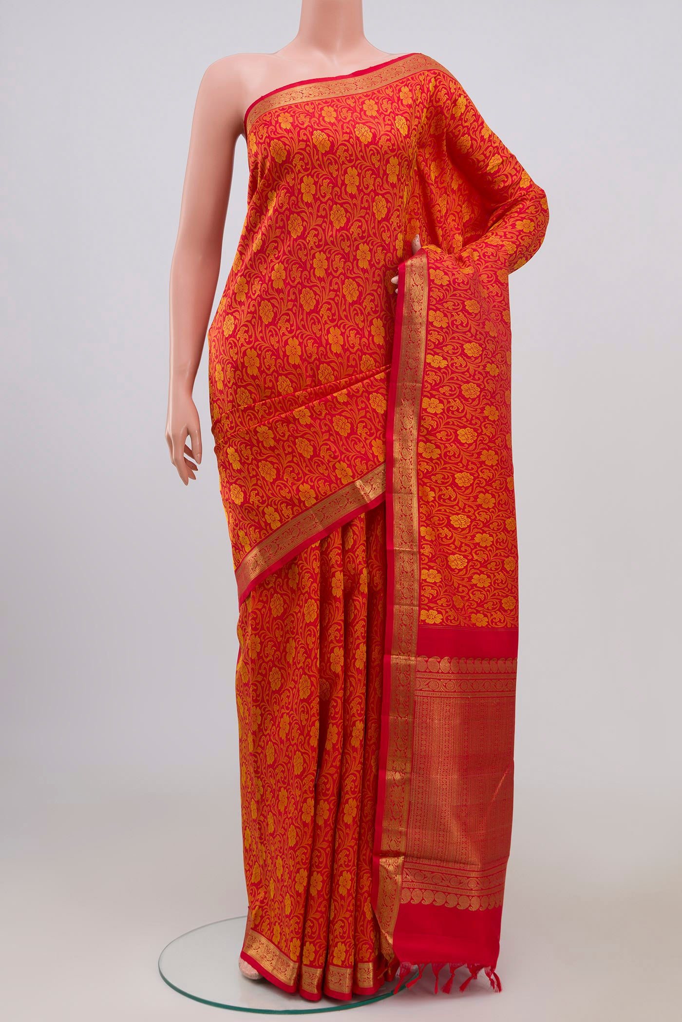 Pure Silk Pure Zari Red Kanjivaram Saree with Jacquard design on the body and Zari Border.  displayed on a mannequin