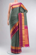 Grey Kanchipuram Silk Saree with Plain Body and Zari Border displayed on a mannequin