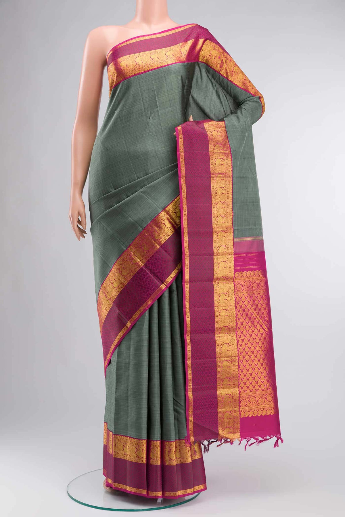 Grey Kanchipuram Silk Saree with Plain Body and Zari Border displayed on a mannequin