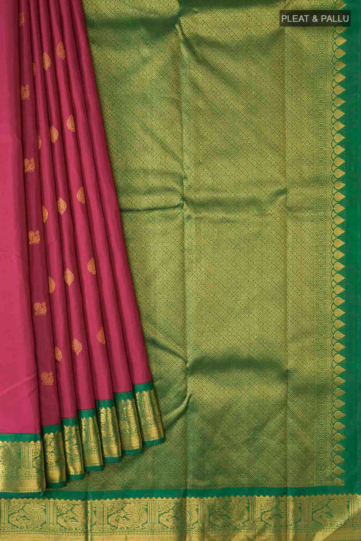 Pleats and pallu of Magenta Kanchipuram Silk Saree with Zari Butta on the body and Zari Border