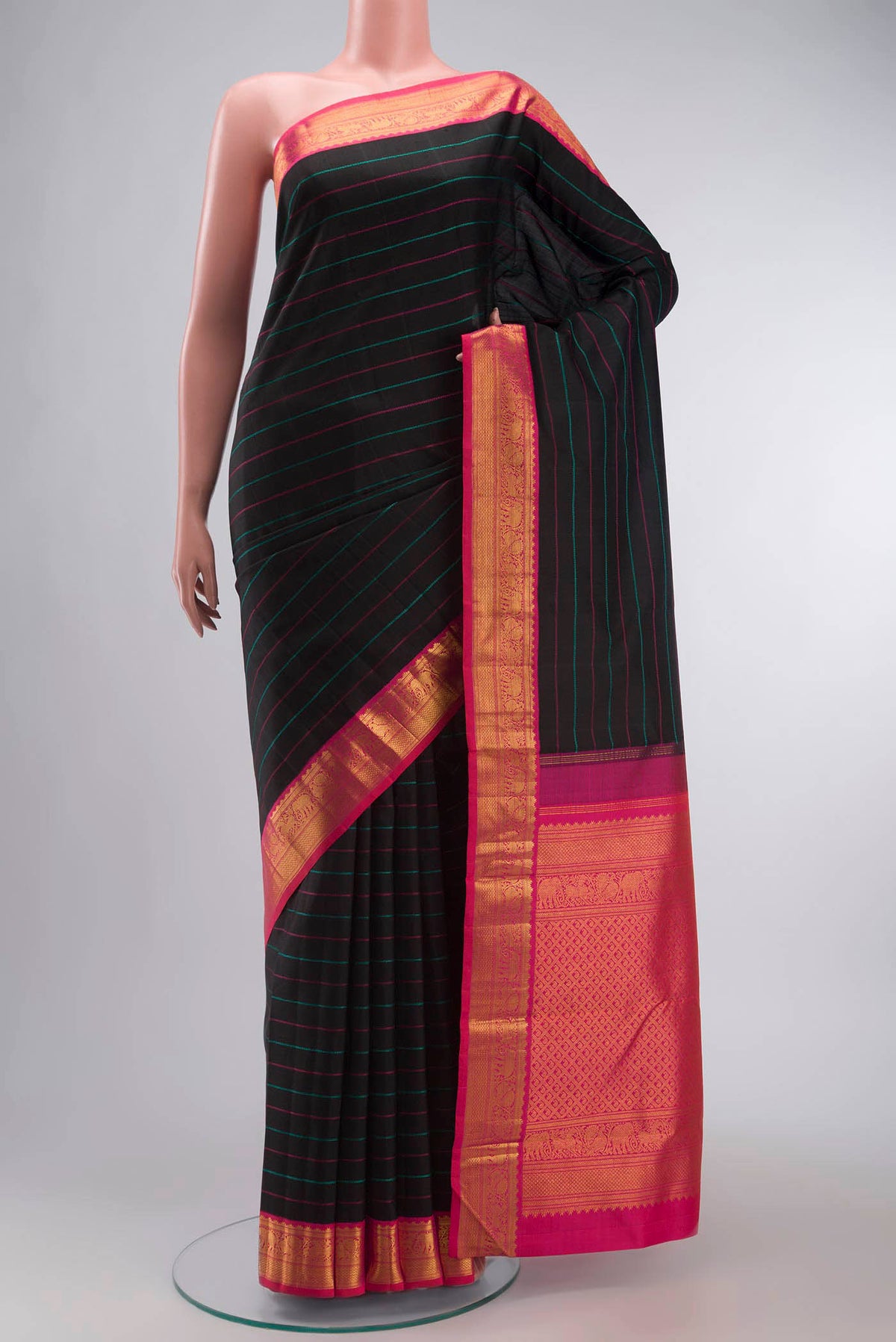Black Kanchipuram Silk Saree with Stripes on the body and Zari Border displayed on a mannequin