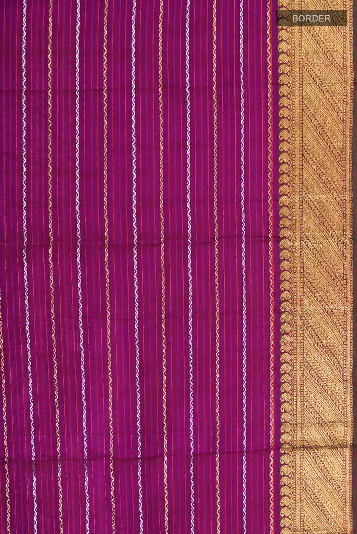Border image of Pure Silk Pure Zari Purple Kanchipuram Saree Checked design on the body and Zari Border