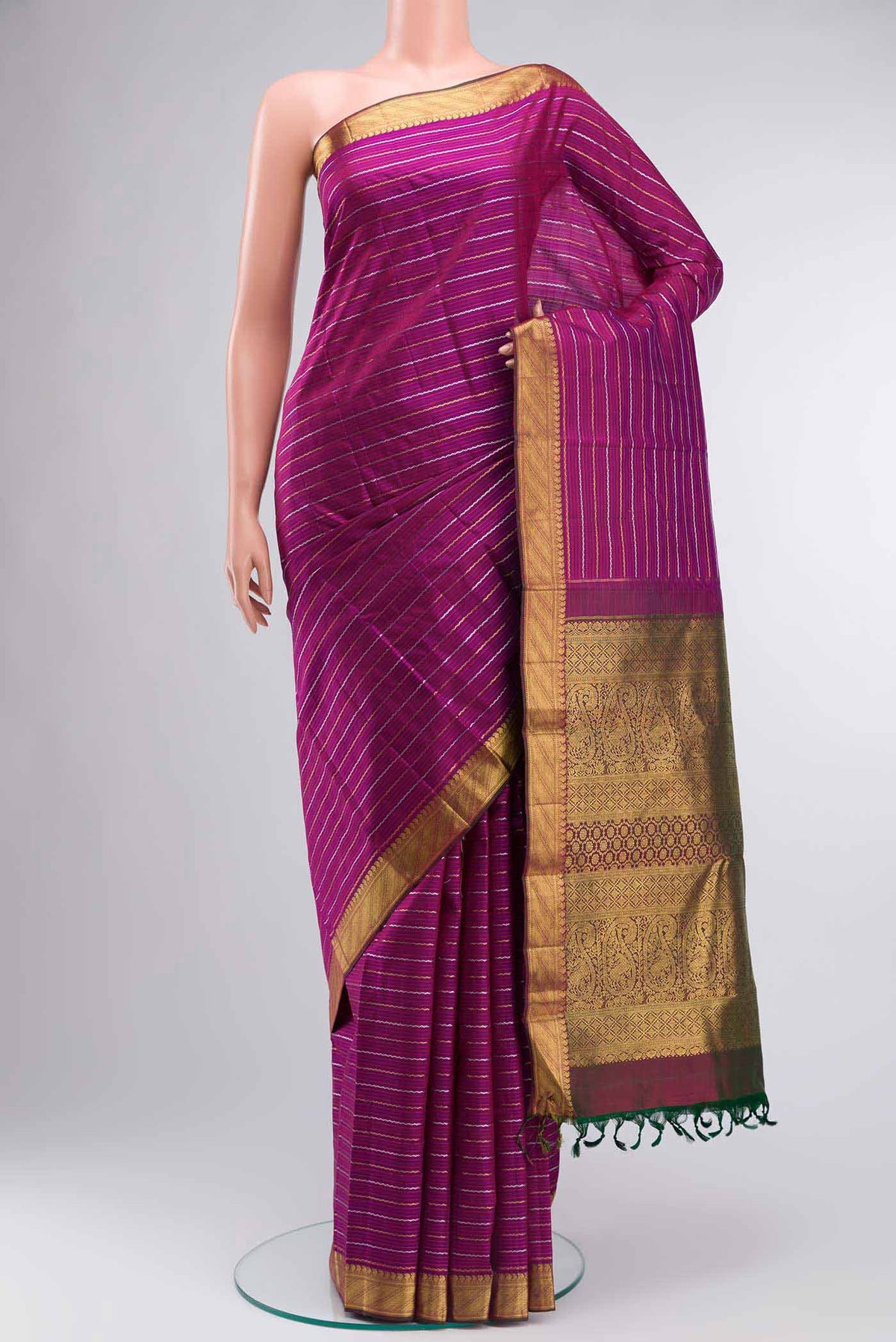 Pure Silk Pure Zari Purple Kanchipuram Saree Checked design on the body and Zari Border displayed on a mannequin