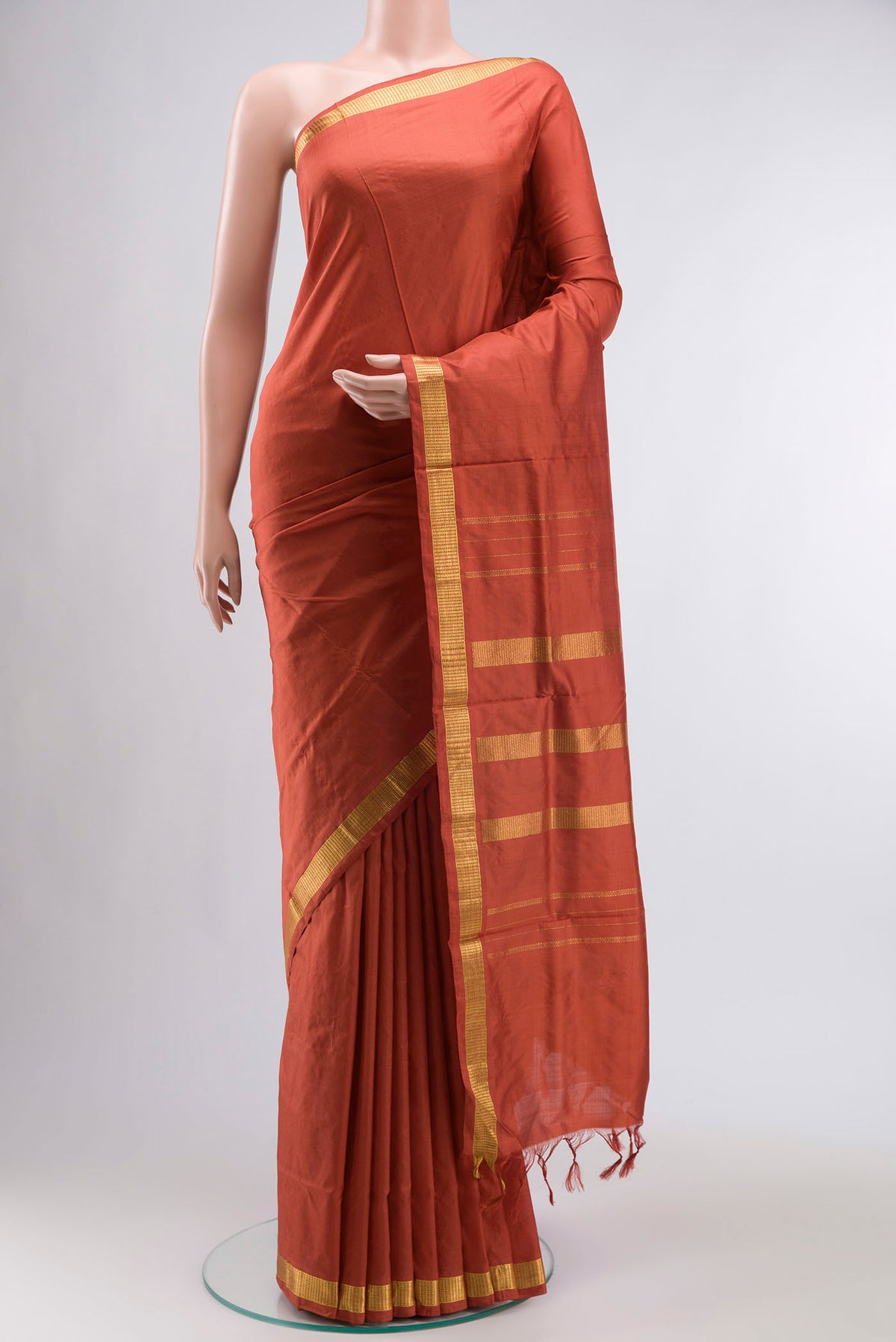 Rust Kanchipuram Silk Nine Yards Saree with Plain Body and Zari Border displayed on a mannequin