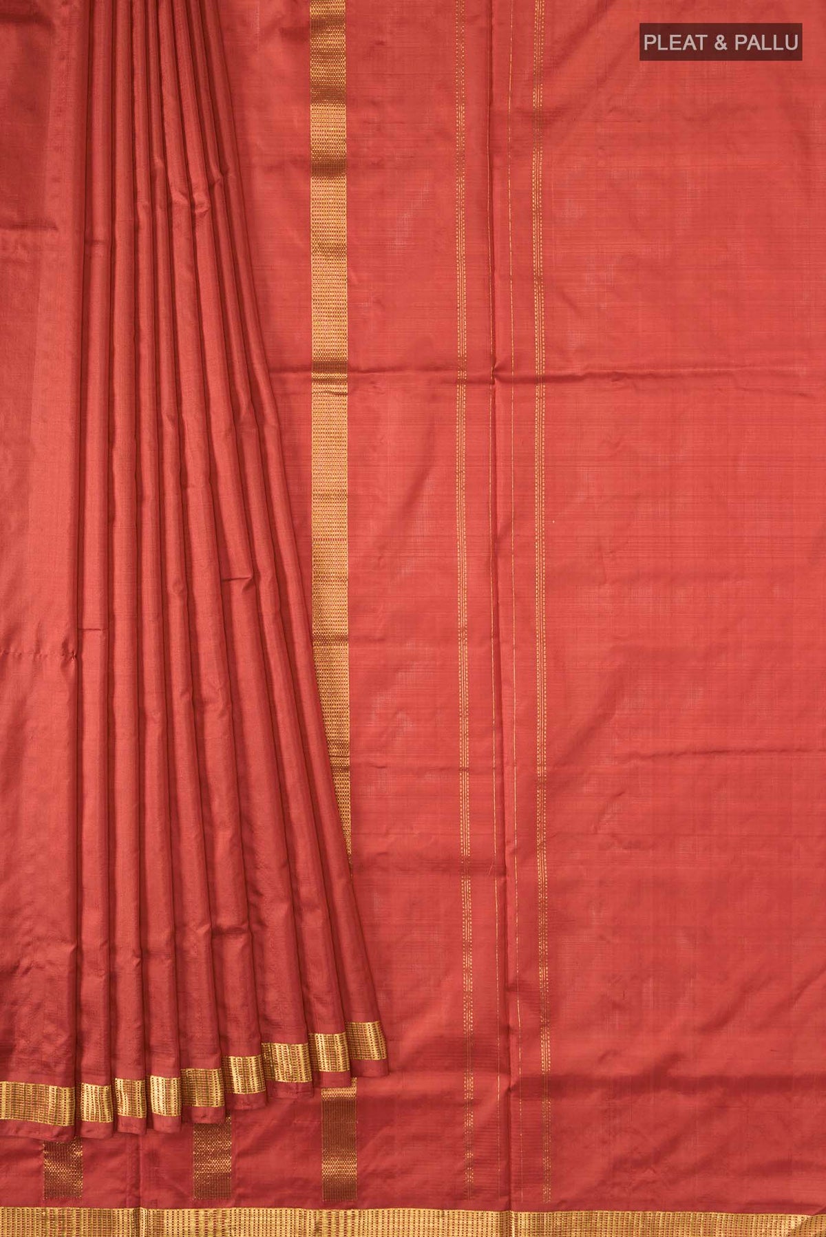 Pleats and pallu of Rust Kanchipuram Silk Nine Yards Saree with Plain Body and Zari Border