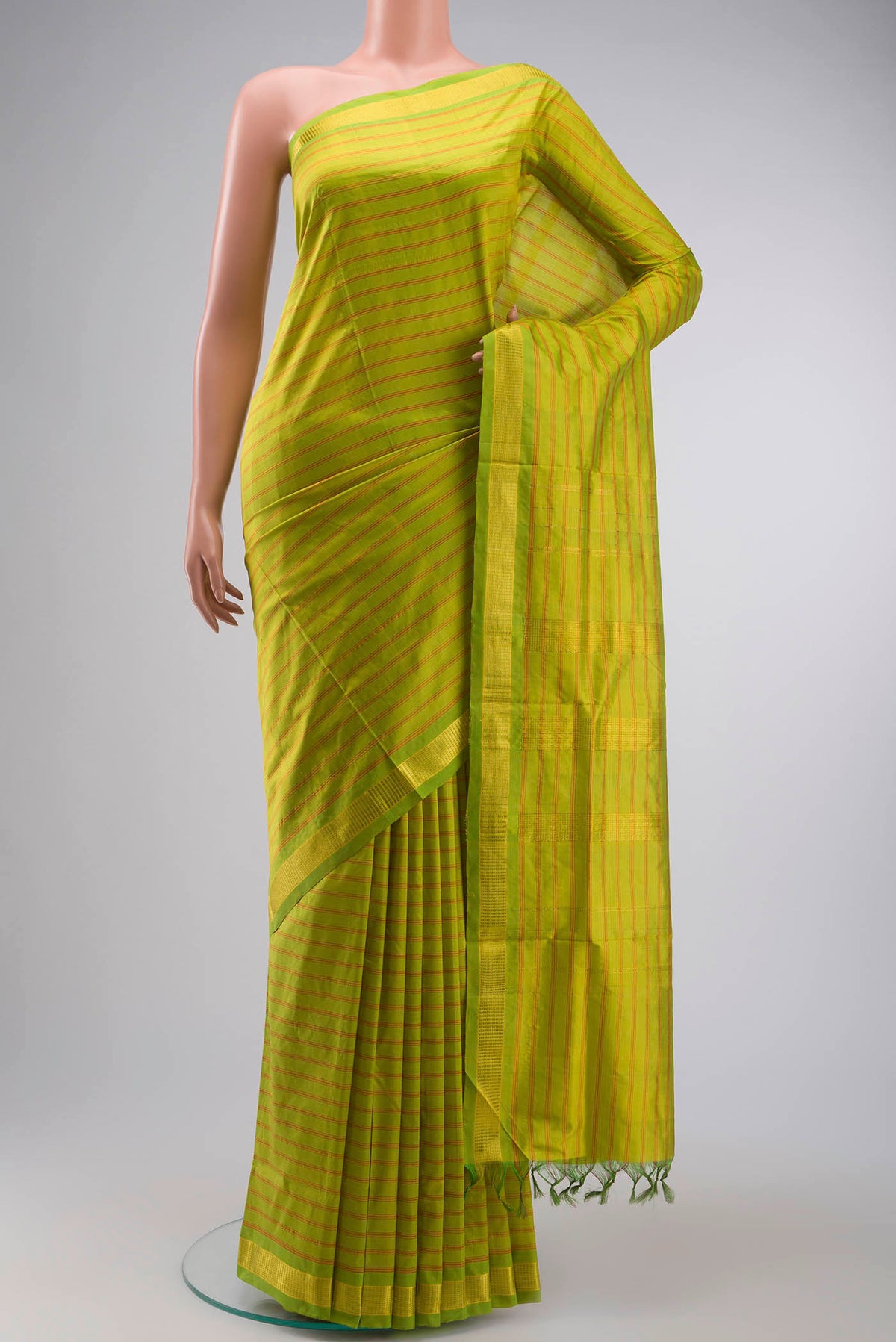 Green Kanchipuram Silk Nine Yards Saree with Stripes on the body and Zari Border displayed on a mannequin
