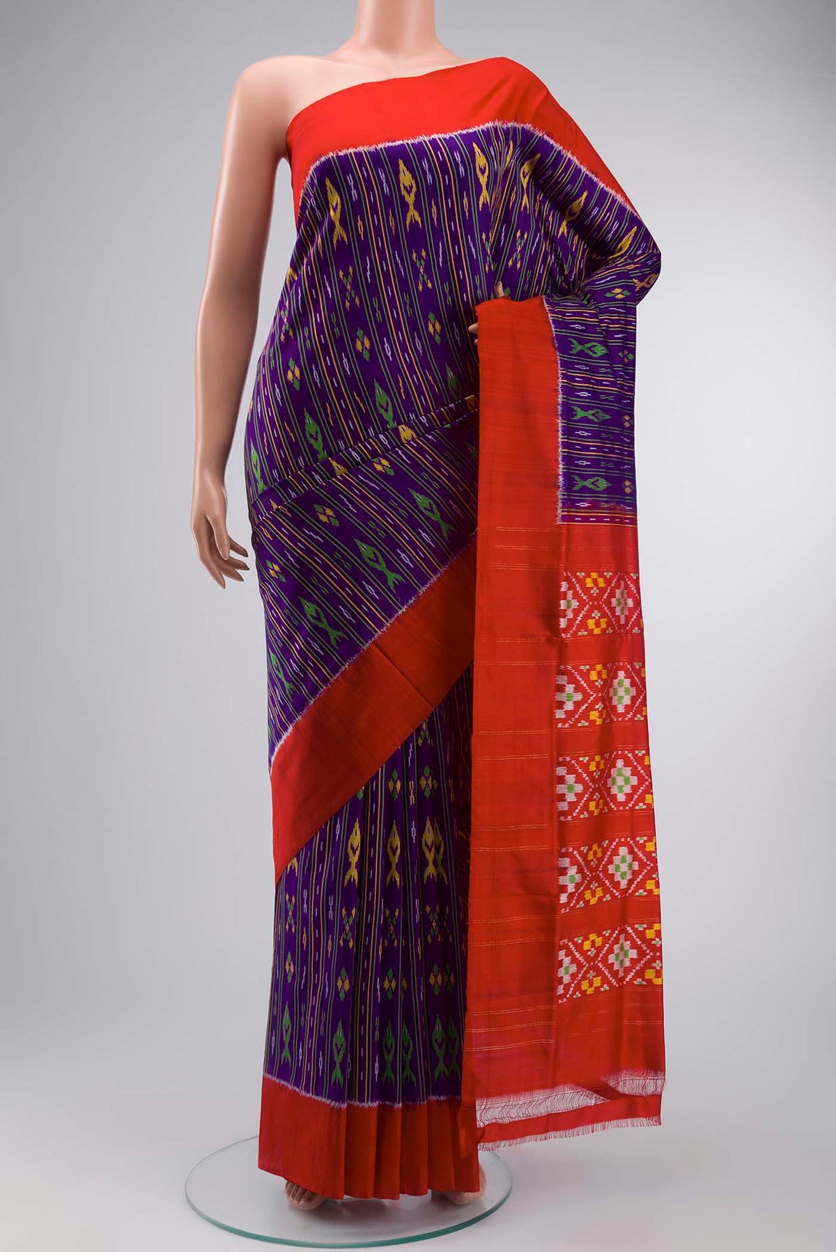 Violet Pochampally Silk Saree with Pure Ikat on the body and Plain Border displayed on a mannequin