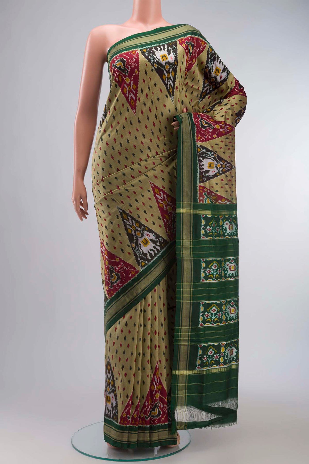 Green Pochampally Silk Saree with Pure Ikat on the body and Zari Border displayed on a mannequin