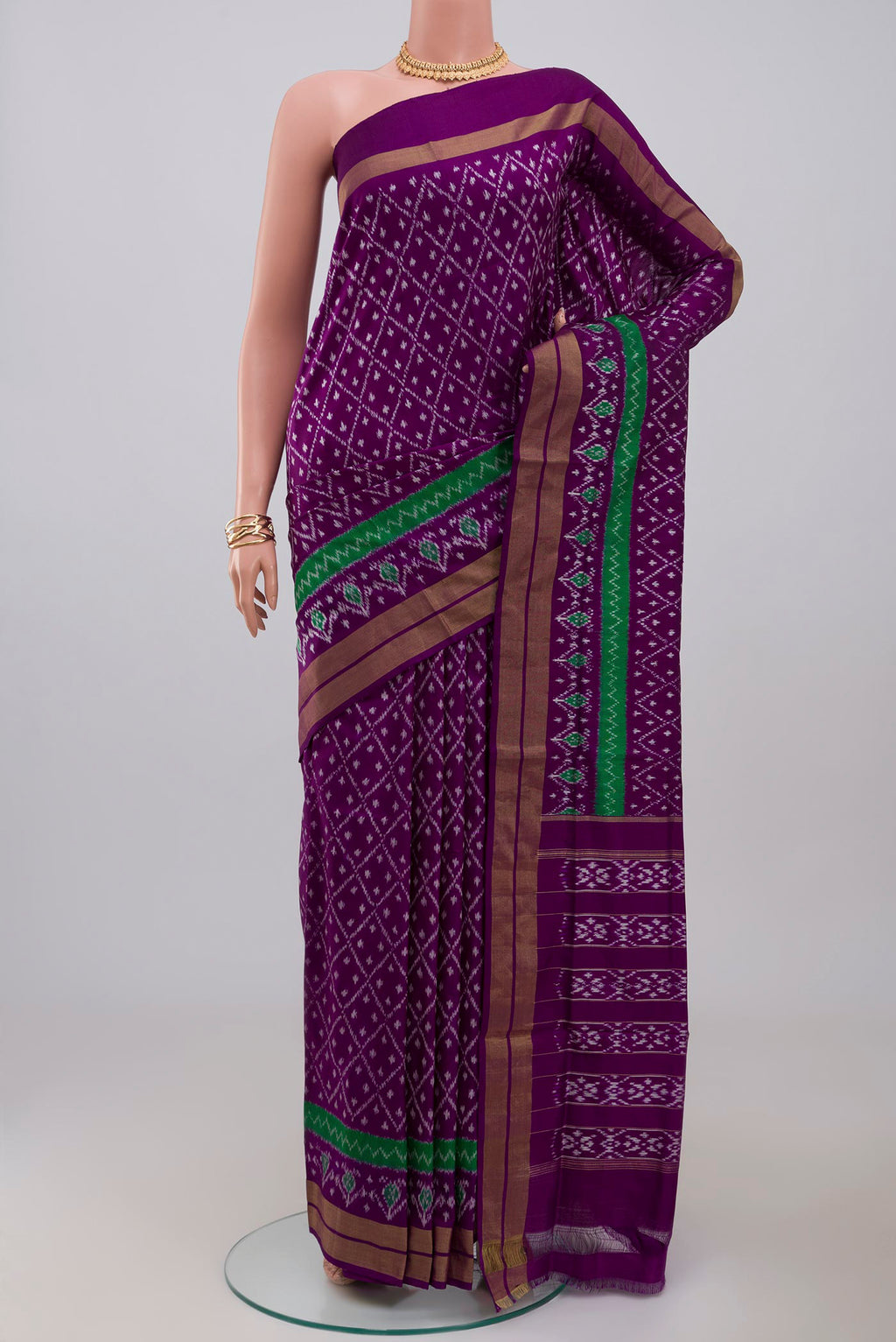 Purple Pochampally Silk Saree with Ikat design on the body and Zari Border.  displayed on a mannequin