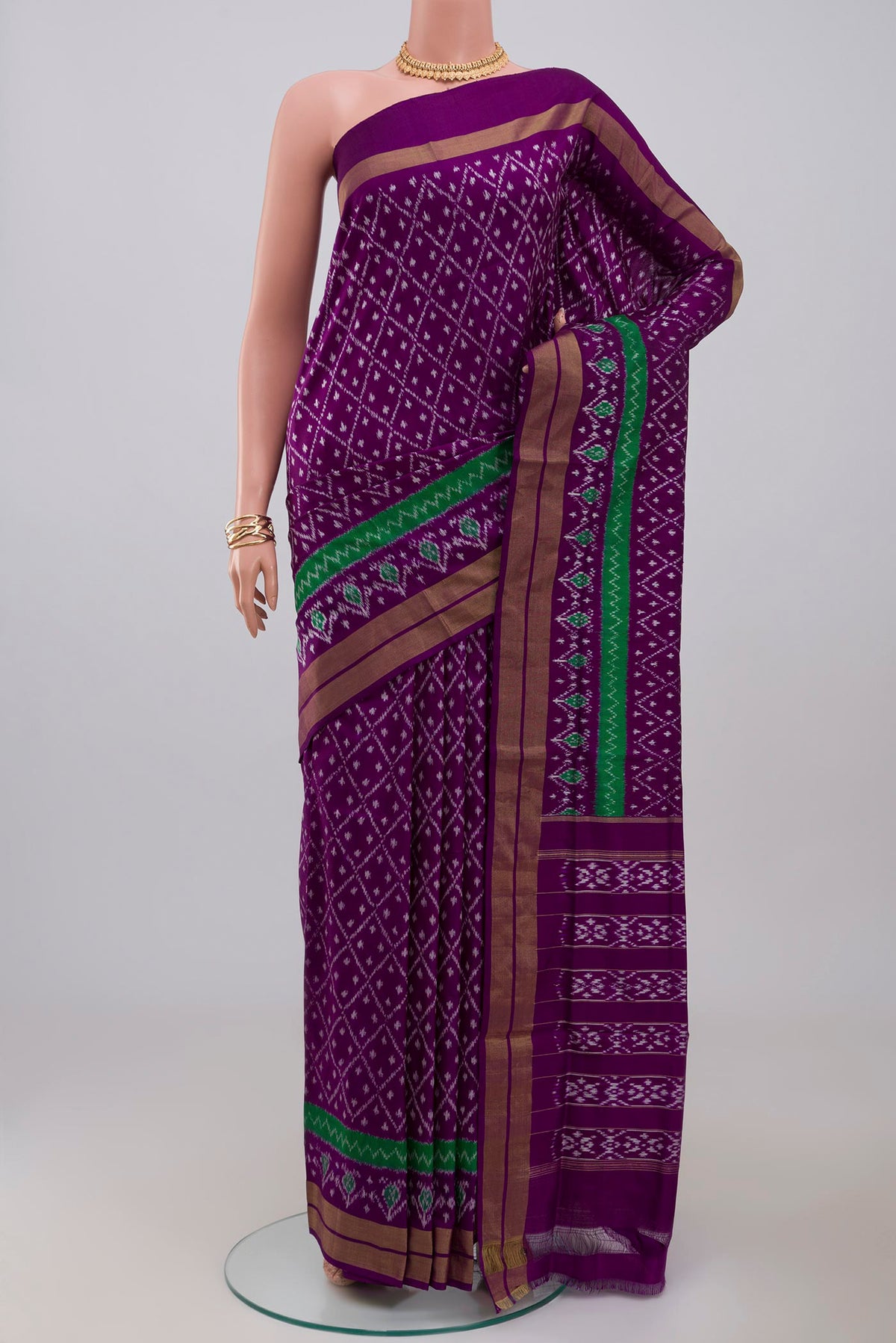 Purple Pochampally Silk Saree with Ikat design on the body and Zari Border.  displayed on a mannequin