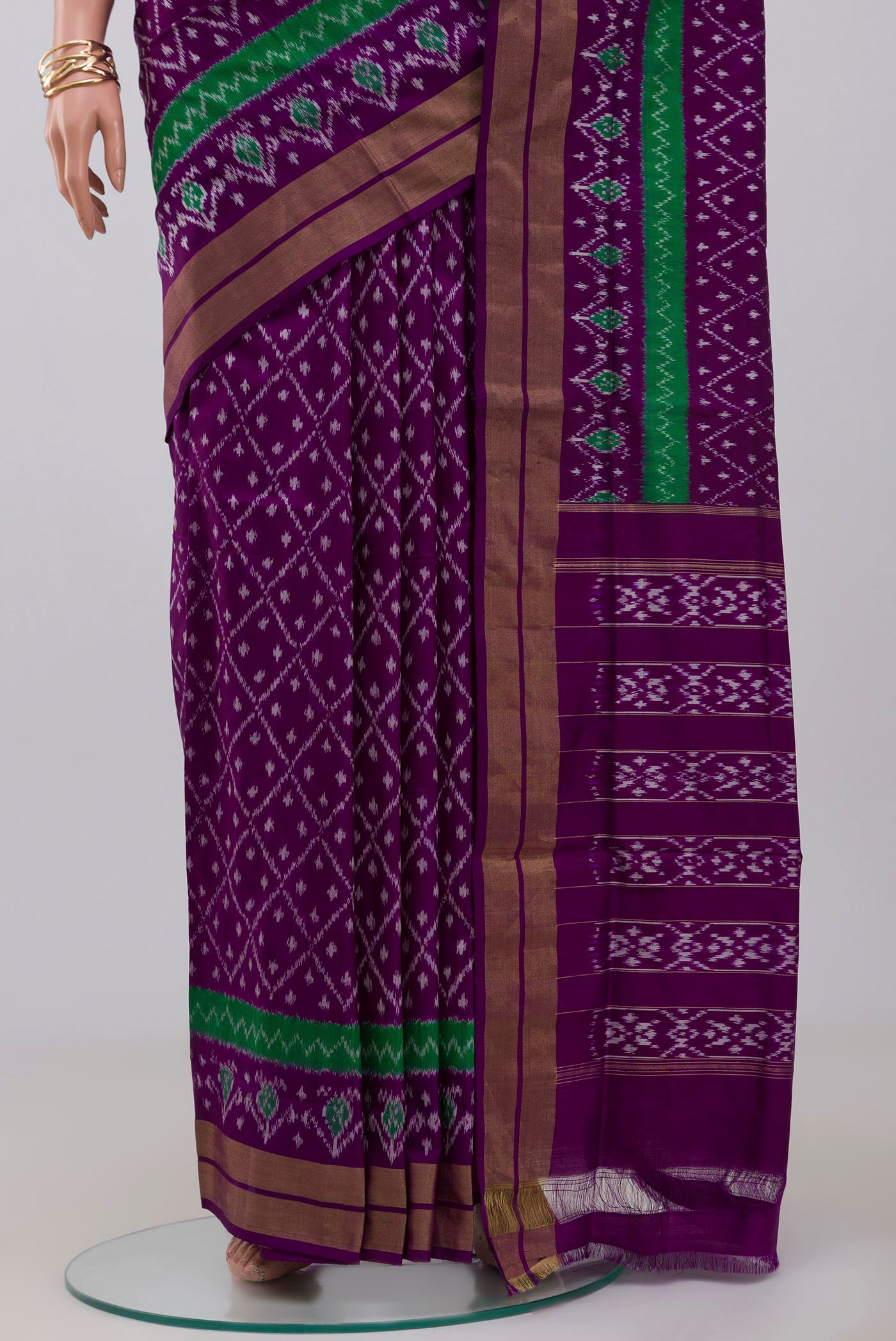 Pleats and pallu of Purple Pochampally Silk Saree with Ikat design on the body and Zari Border. 
